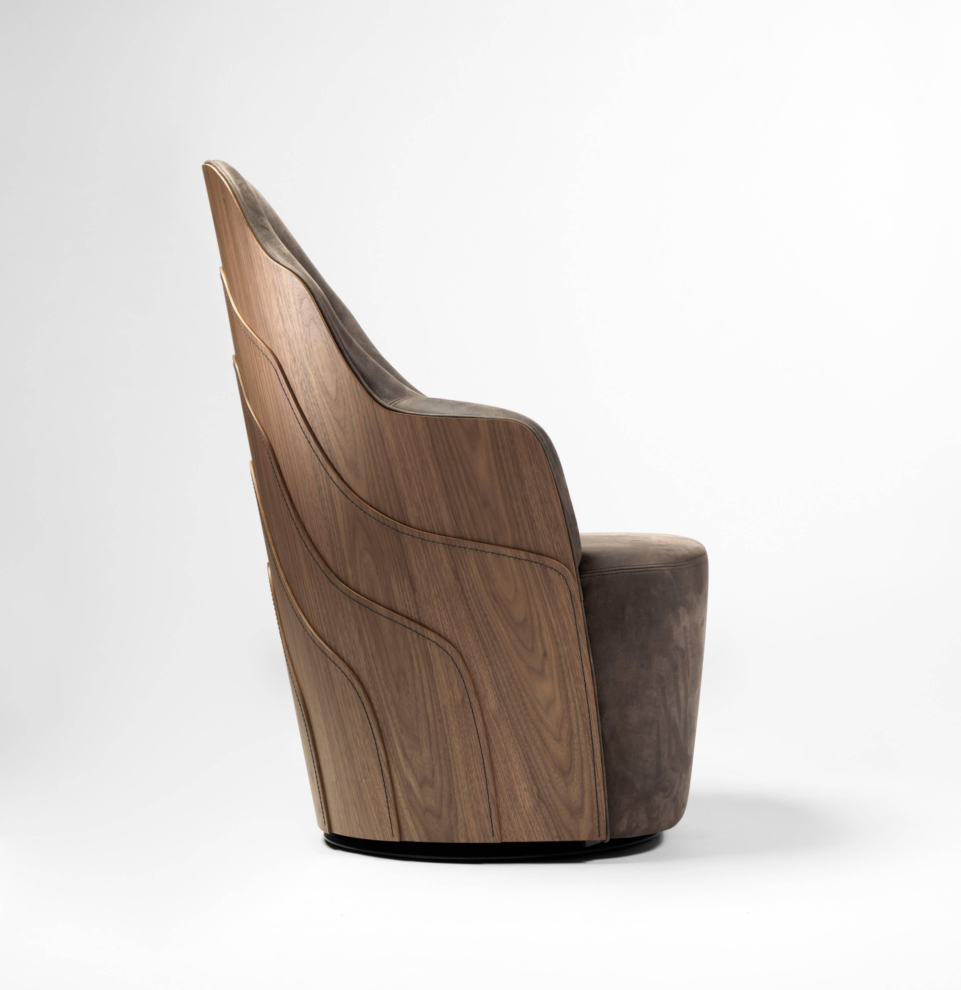 The Couture Armchair is a fusion of artisanal and industrial techniques. The stitches represent a topographic map resulting in an organic pattern, simulating the growth in wood. The use of gradient colours for the wood, amplifies the effect of