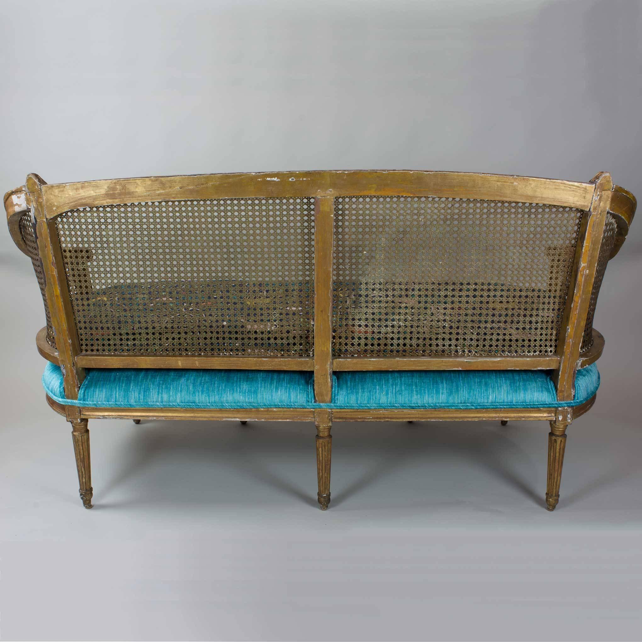 Contemporaries of Louis XVI and Marie Antoinette may once have perched upon this lovely old settee dating from 1780. Surely an inviting place of repose for a busy socialite centuries ago, it gently shows its age today, yet maintains its natural