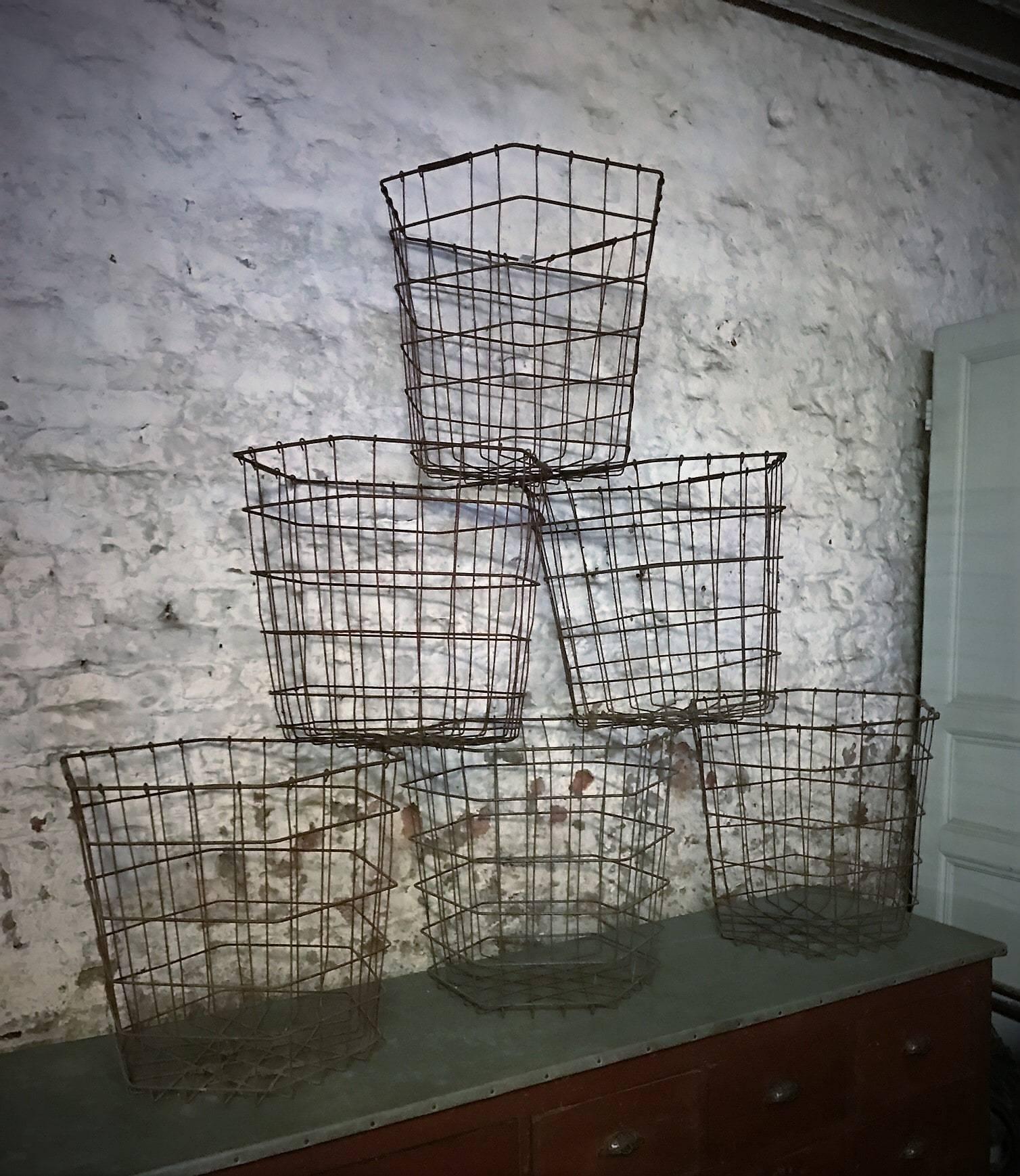 Add a rustic touch to your décor with this large round wire basket. As you can see, most of the paint has given way to light rust, giving it a very attractive, homey appearance. Sturdy and spacious, this basket has probably seen many uses, from