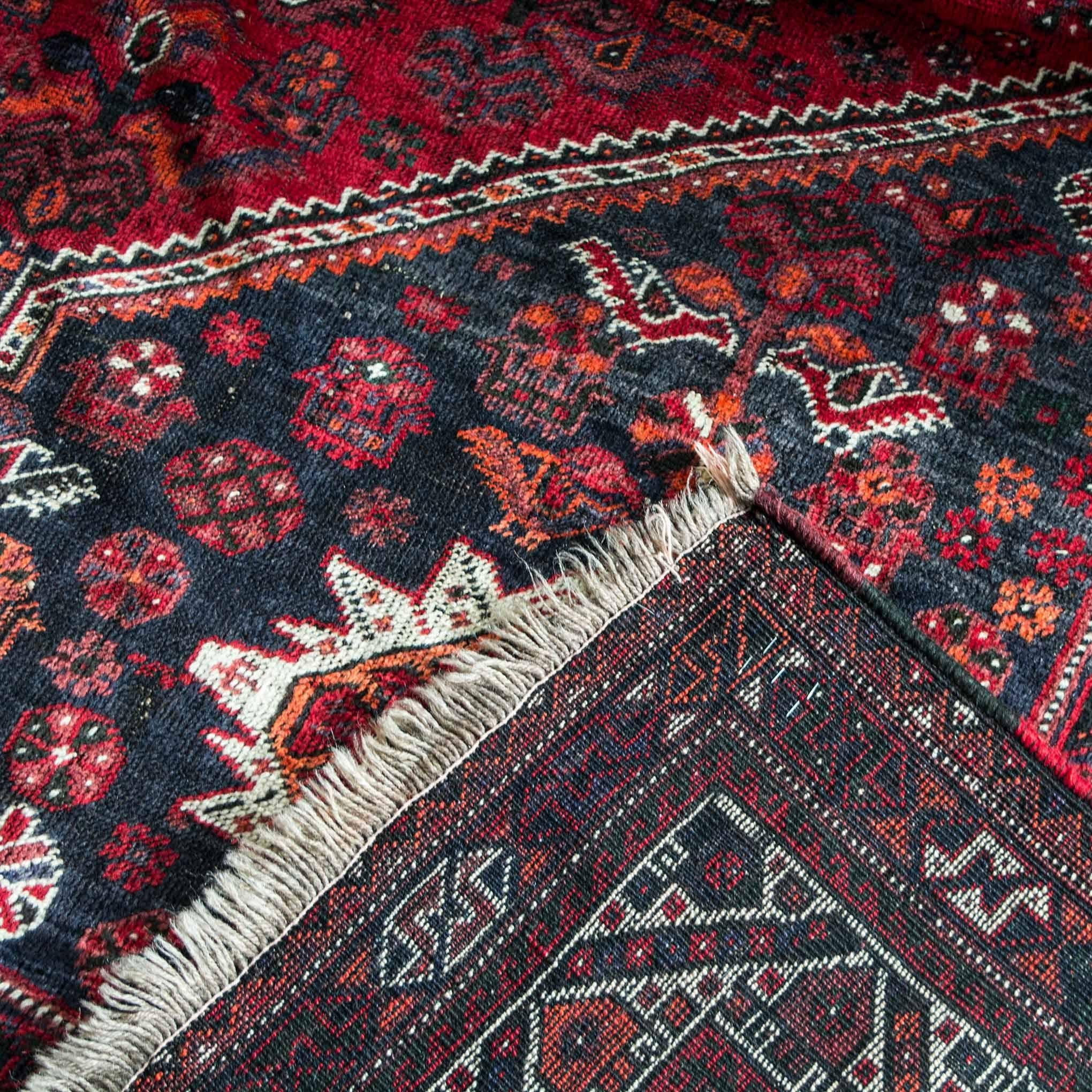 Caucasian rug is in rich color with an all-over design. The colorful tribal ornaments in decorate this rug with a unique centre pattern. It is in good condition. Hand knotted wool.