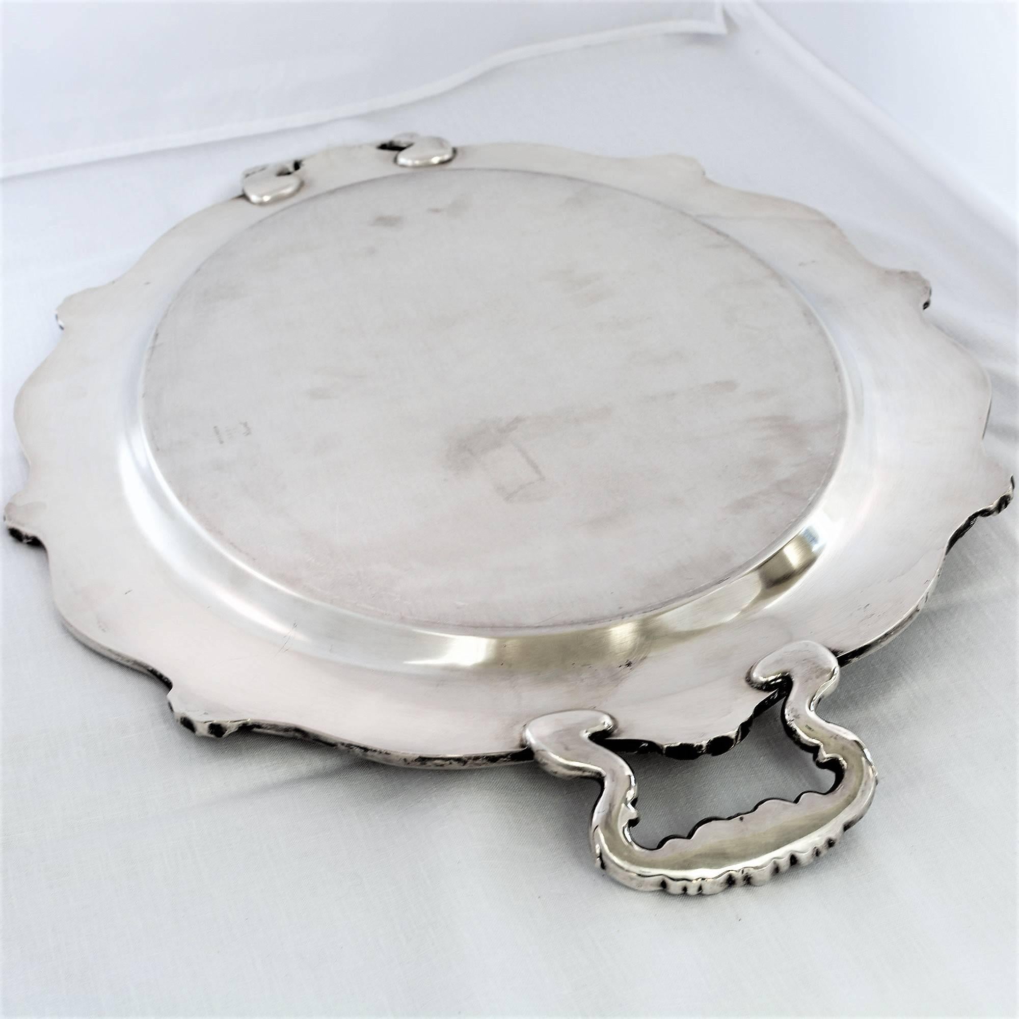 Amazing large silver plate Regent pattern Reed and Barton butler tray is from the early 1900s. Ornate French style etchings on the platter's service and sculptured with scrolls, leaf and floral accents. This tray is a lovely reminder of the gracious