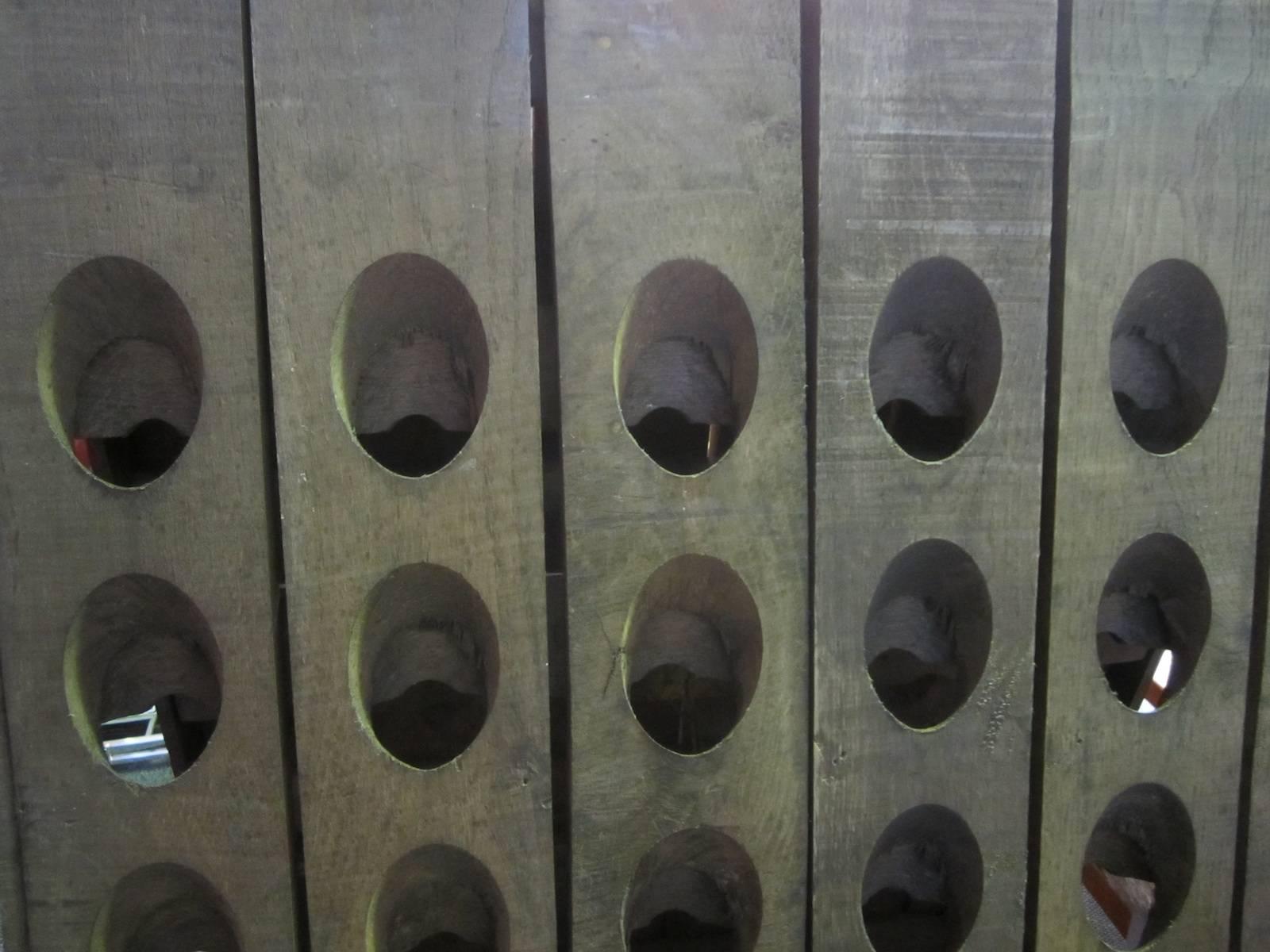 Double sided French oak riddling rack for champagne, 
the bottles are periodically turned (riddled) to aid fermentation, 
holds 120 bottles (60 each side), 
11cm thick (each piece 5.5cm thick) 72 x 152cm.