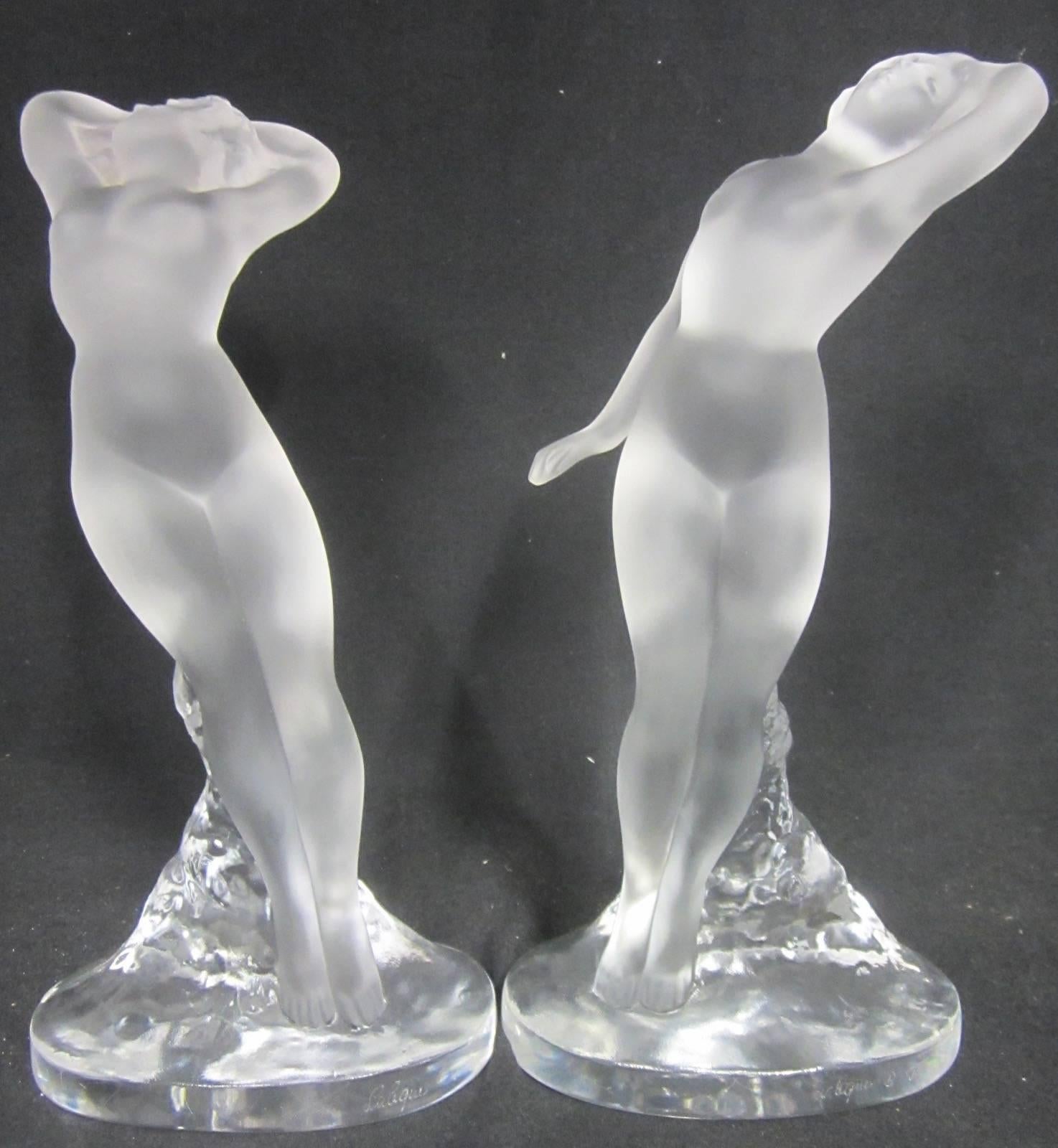 Pair of Lalique frosted glass danseuse nude dancer figurines.
One with arms up, one with arm out.
Both signed Lalique France
Measure: 24cm high.