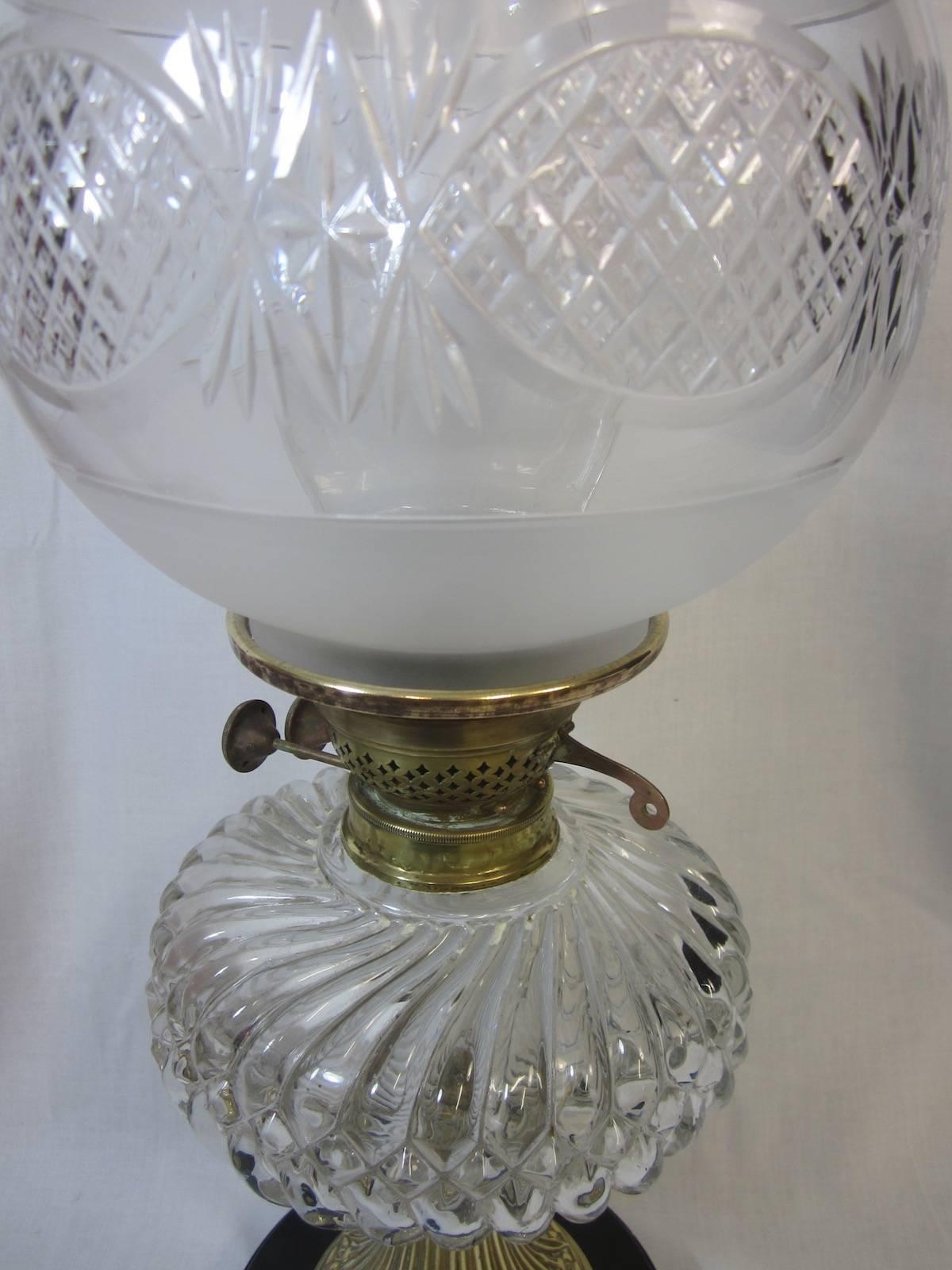 Duplex twin burner oil lamp,
brass base,
Measures: 22 x 58 cm high.