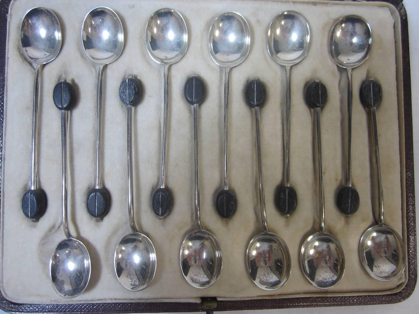 Set of 12 Asprey & Co. sterling silver boxed coffee spoons, in an fitted Asprey box.
Hallmarked Sheffield 1911,
Total weight including the coffee beans, 3.2 ounces, 92 grams
Box has some wear commensurate with age.