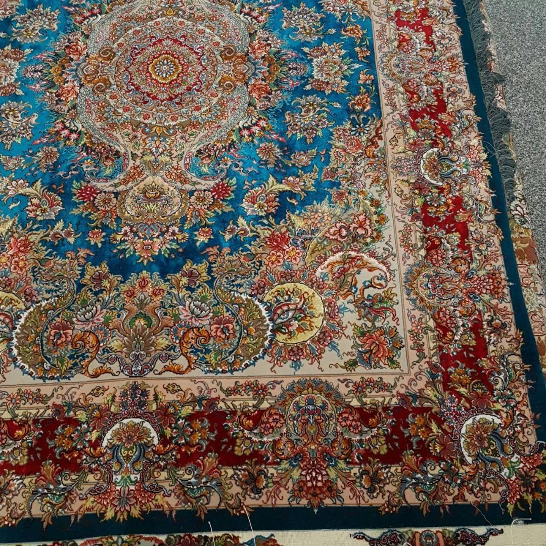 Khatibi turquoise
KPSI: 556
Origin: Tabriz, Iran
Composition: Silk and wool
Available size’s
Size: 207 cm x 150 cm 
Description: Designer of this dazzling piece is Master Khatibi , he has his unique style amongst Persian carpet designers. The
