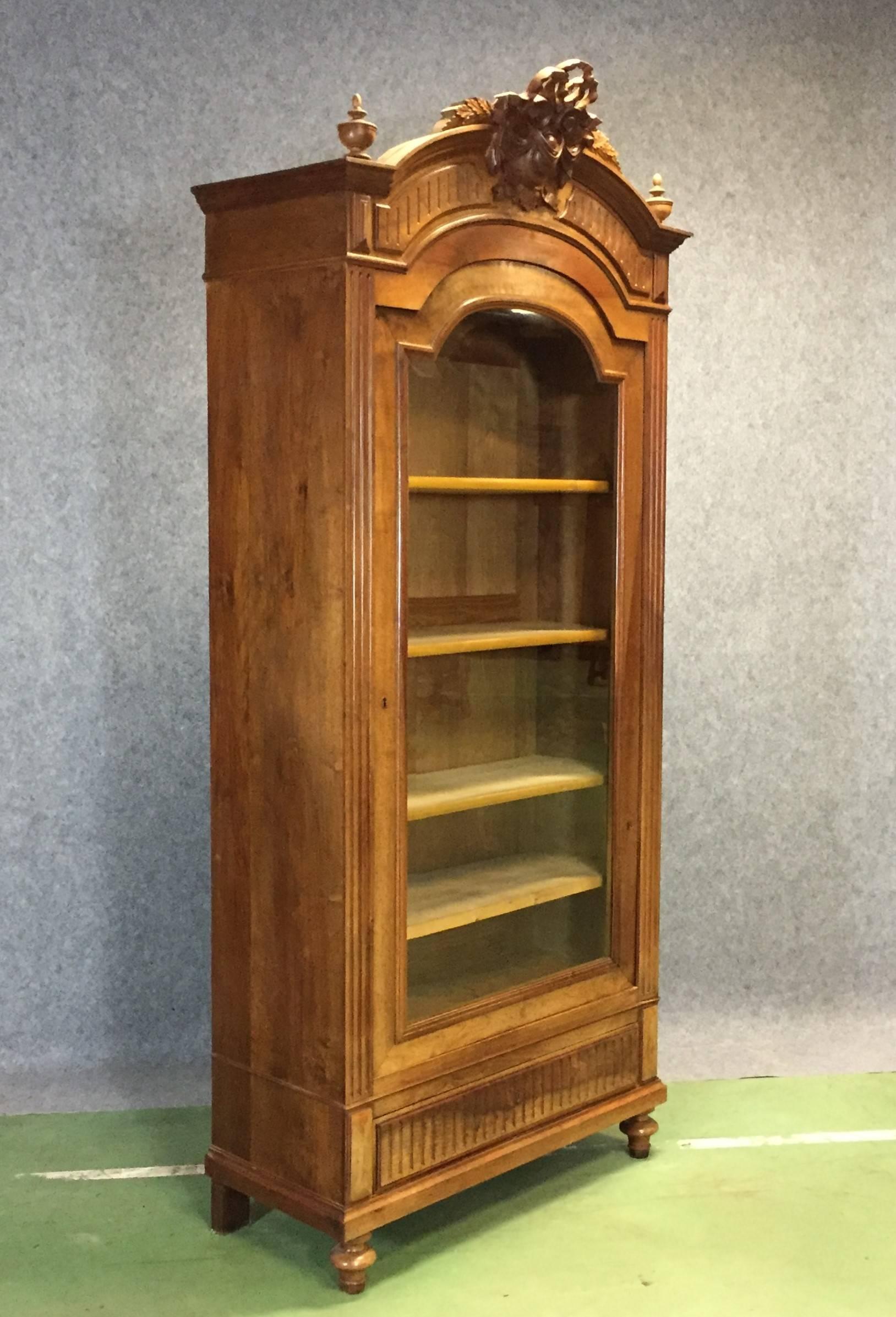 1900s Louis XVI style walnut bookcase.