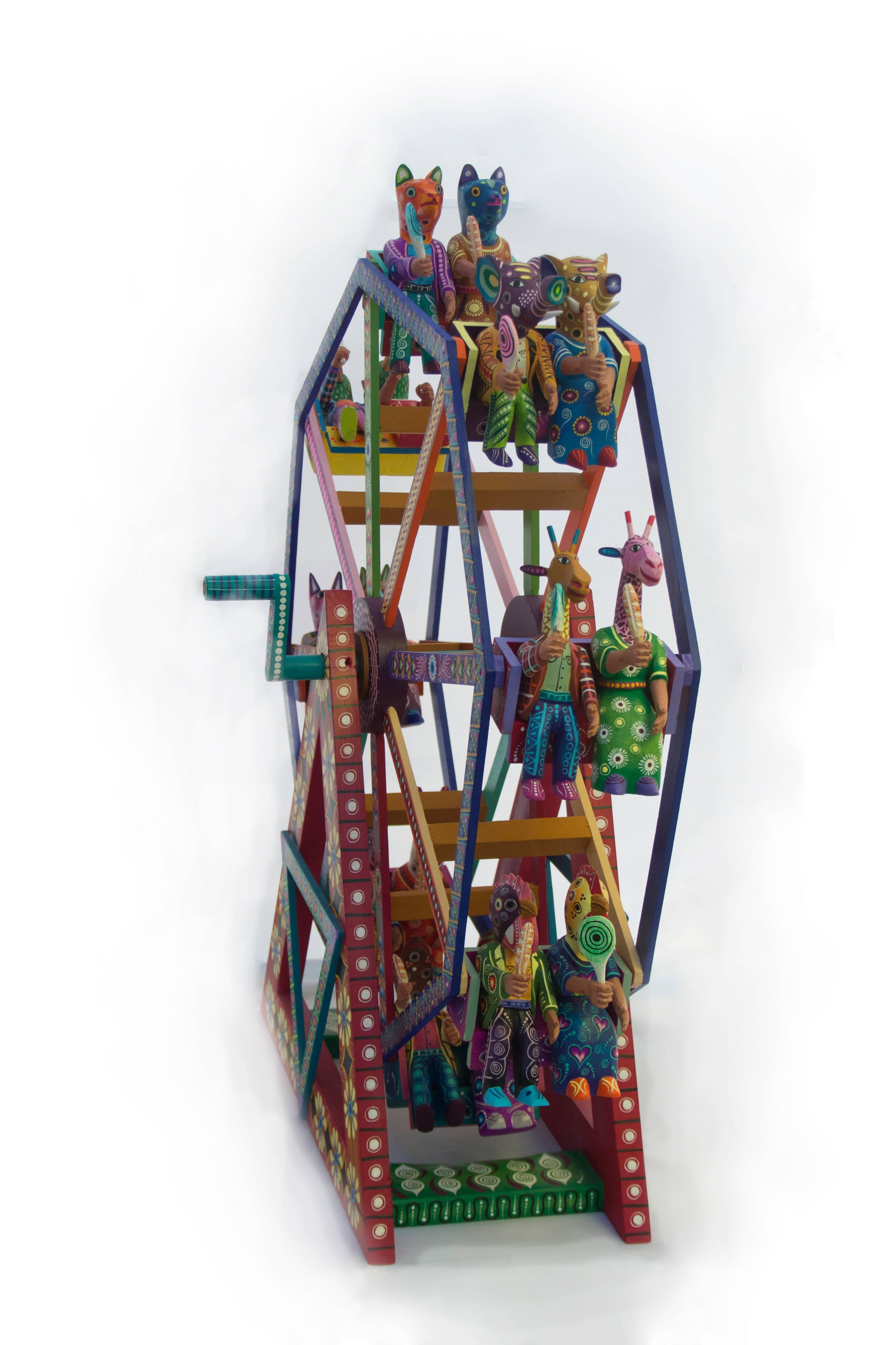 This brilliant piece is one of the fortune wheel collection of the Cruz family. It is through this innovative design that The Cruz family began to be recognized in the wood carving sector, commonly known as "alebrijes" by many folk art