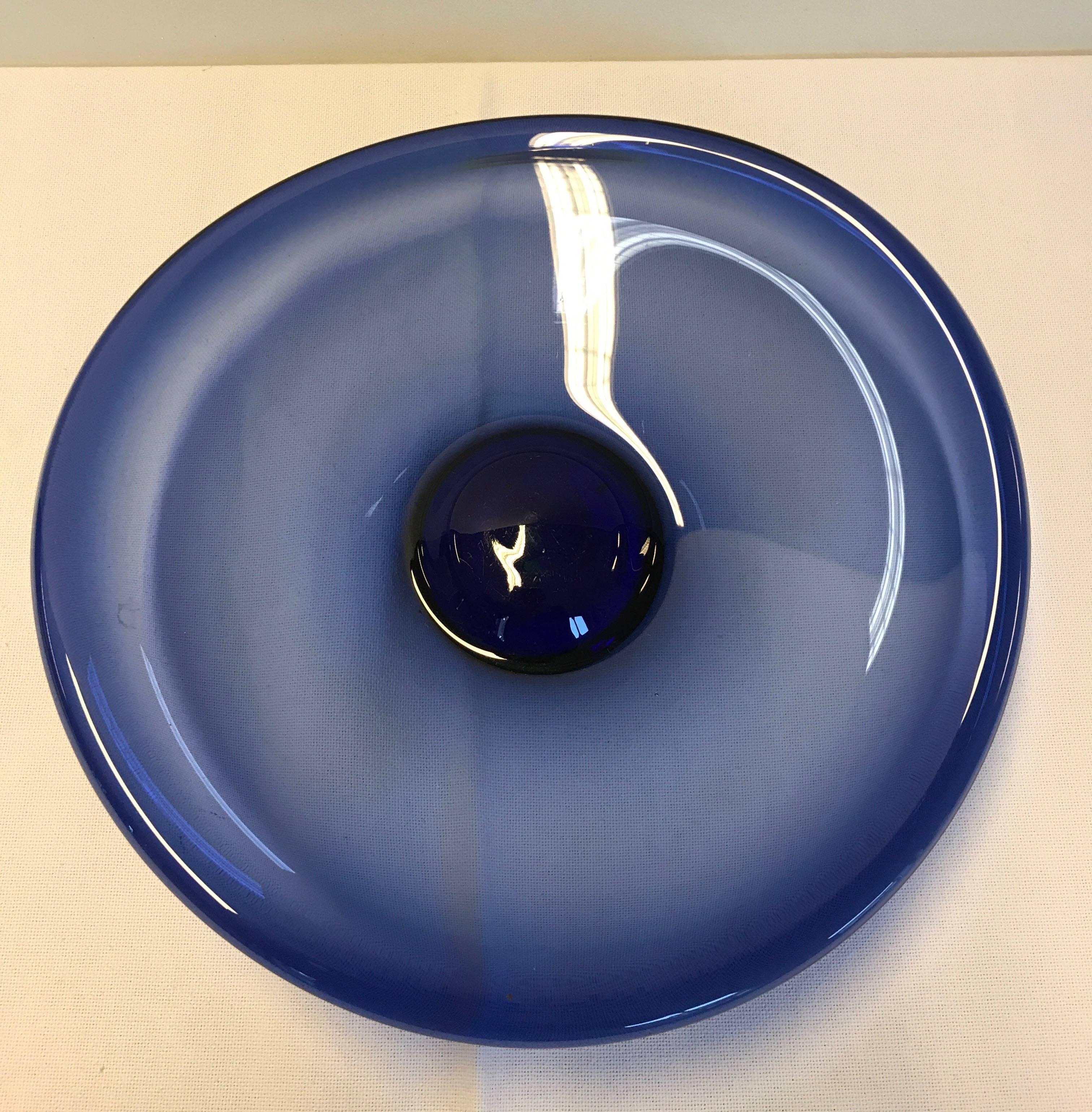 Holmegaard blue glass dish/bowl. By Per Lutken, 1950s, Denmark. Diameter 27 cm, height 6 cm in good condition with very few marks of normal use.