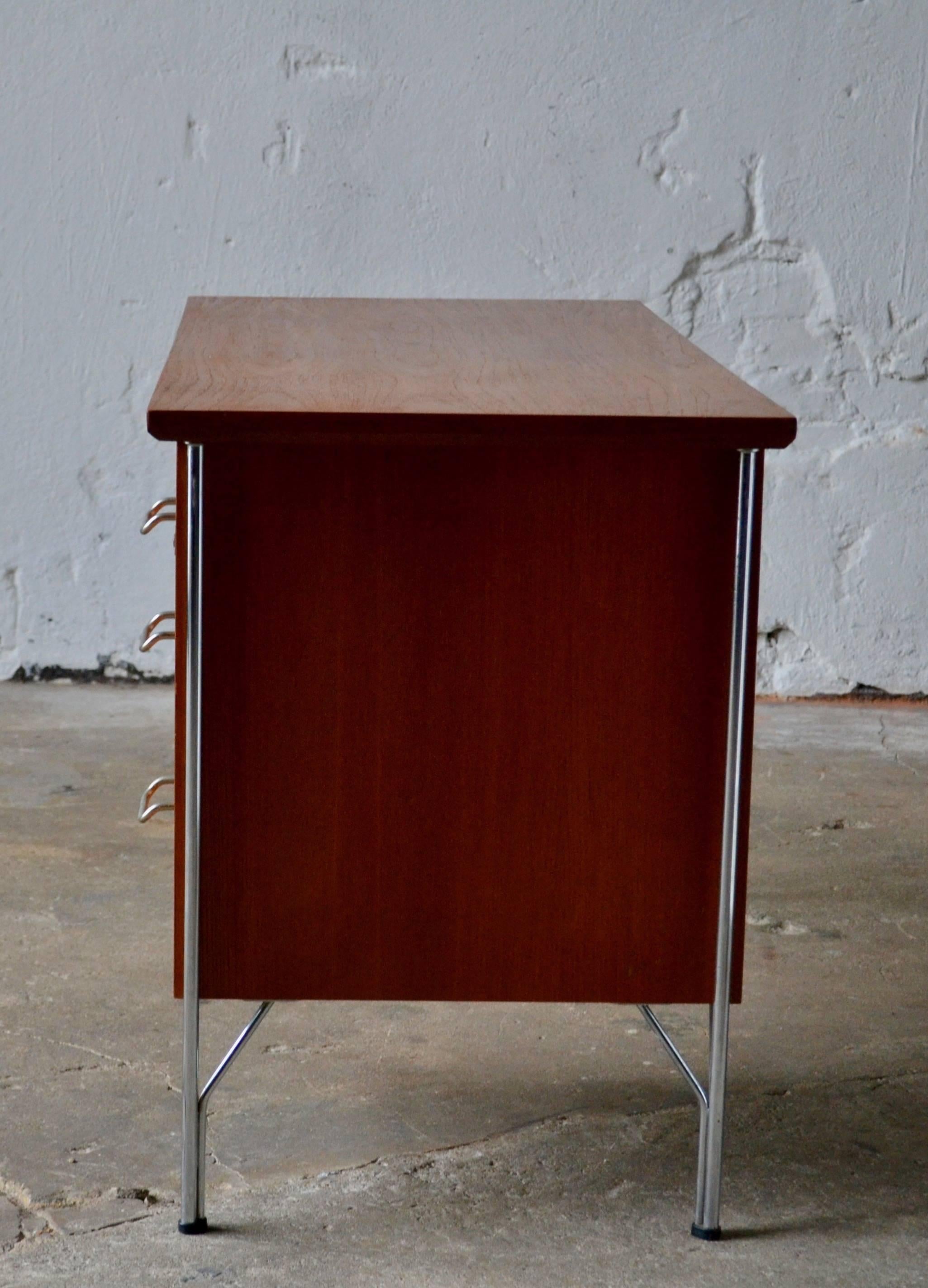Danish teak desk by Heinrich Roepstorff
1950s
Single pedestal teak desk with chromed steel legs and handles.