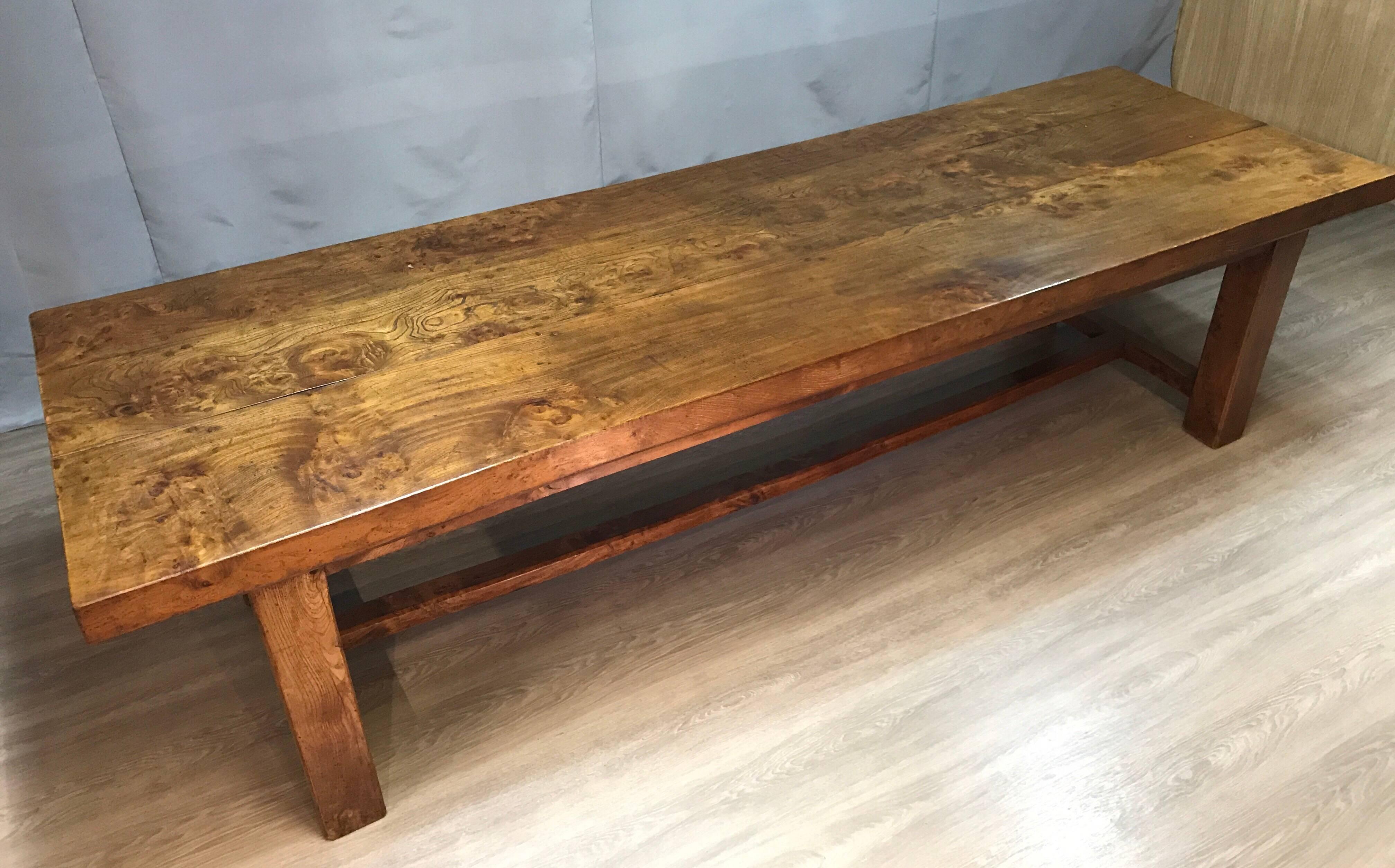 This exceptional late 19th century large elm farmhouse table, has wonderful proportions and stunning color. The beautiful figured 8.5cm thick top sits on four chunky legs, the legs are supported by a centre stretcher. The table was made in Normandy