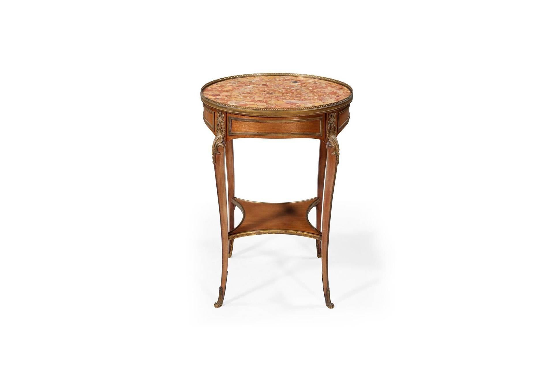 Louis XV style Bouillotte occasional table fitted with gilt metal and marble mounted top. Legs en cabriolet adorned with sabots and espagnolletes.
    