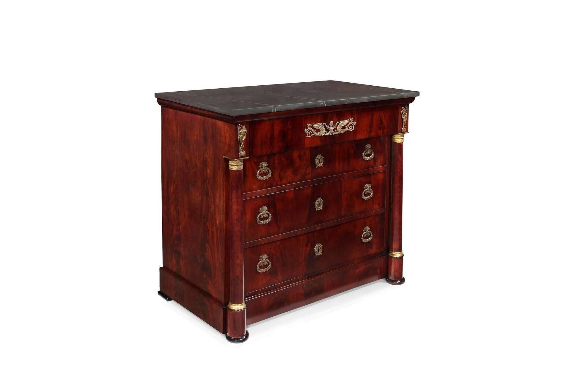 Beautifully proportioned French Empire chest of drawers with decorative cast bronze and marble top.
         