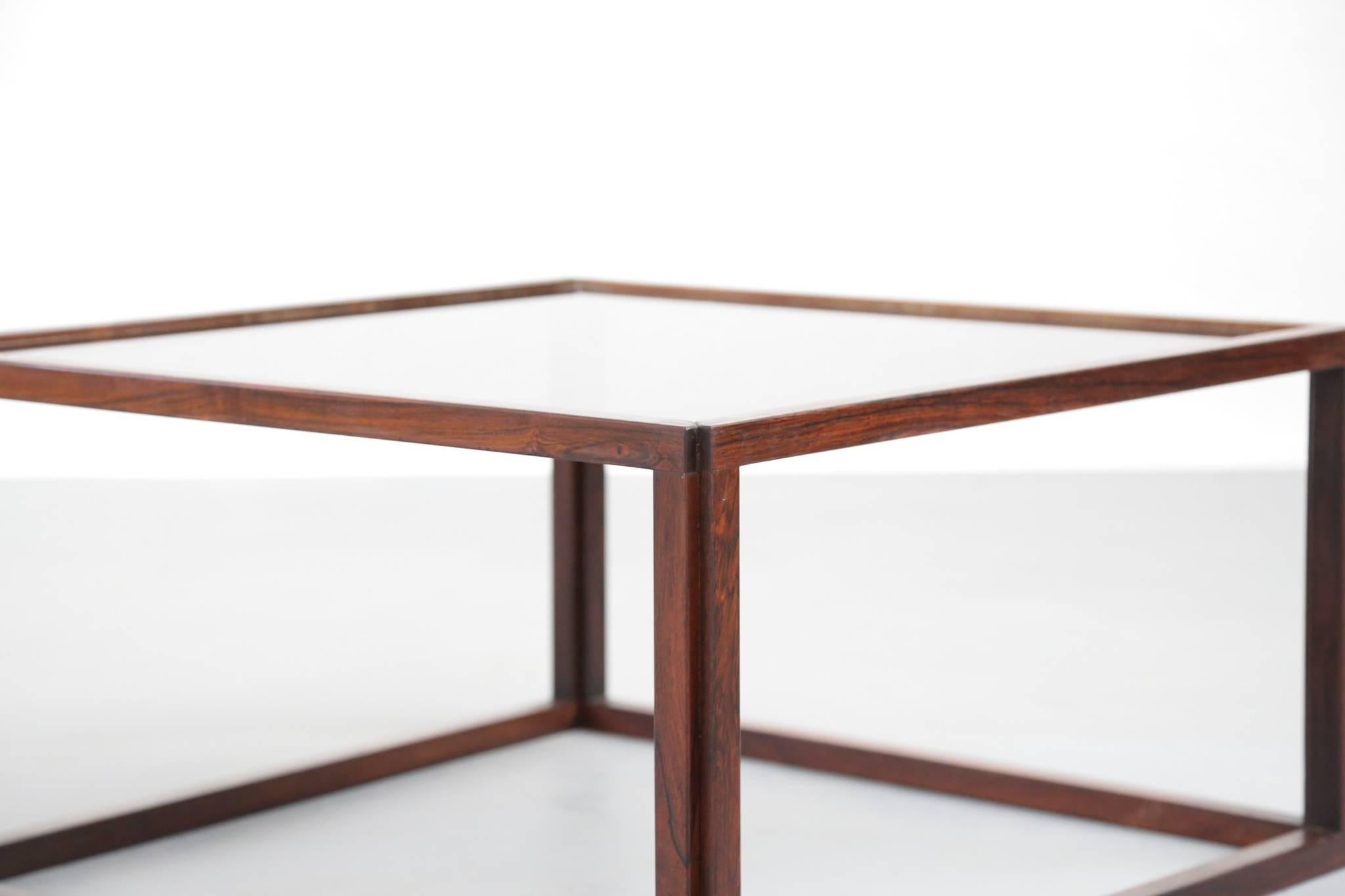 Rare rosewood coffee table with glass on the top.
Excellent condition.

 