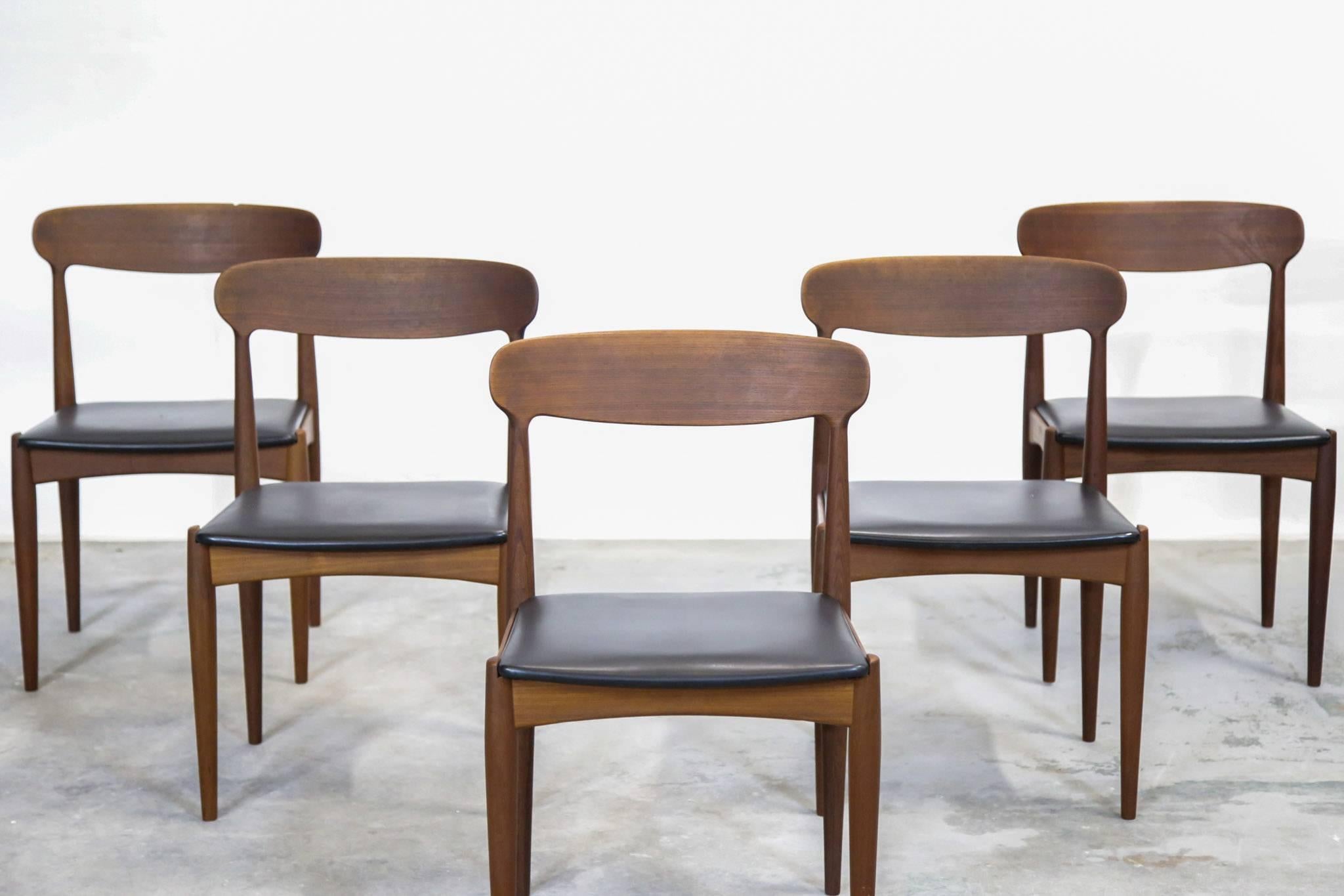 Set of Danish chairs Johannes Andersen made of teak and faux leather.