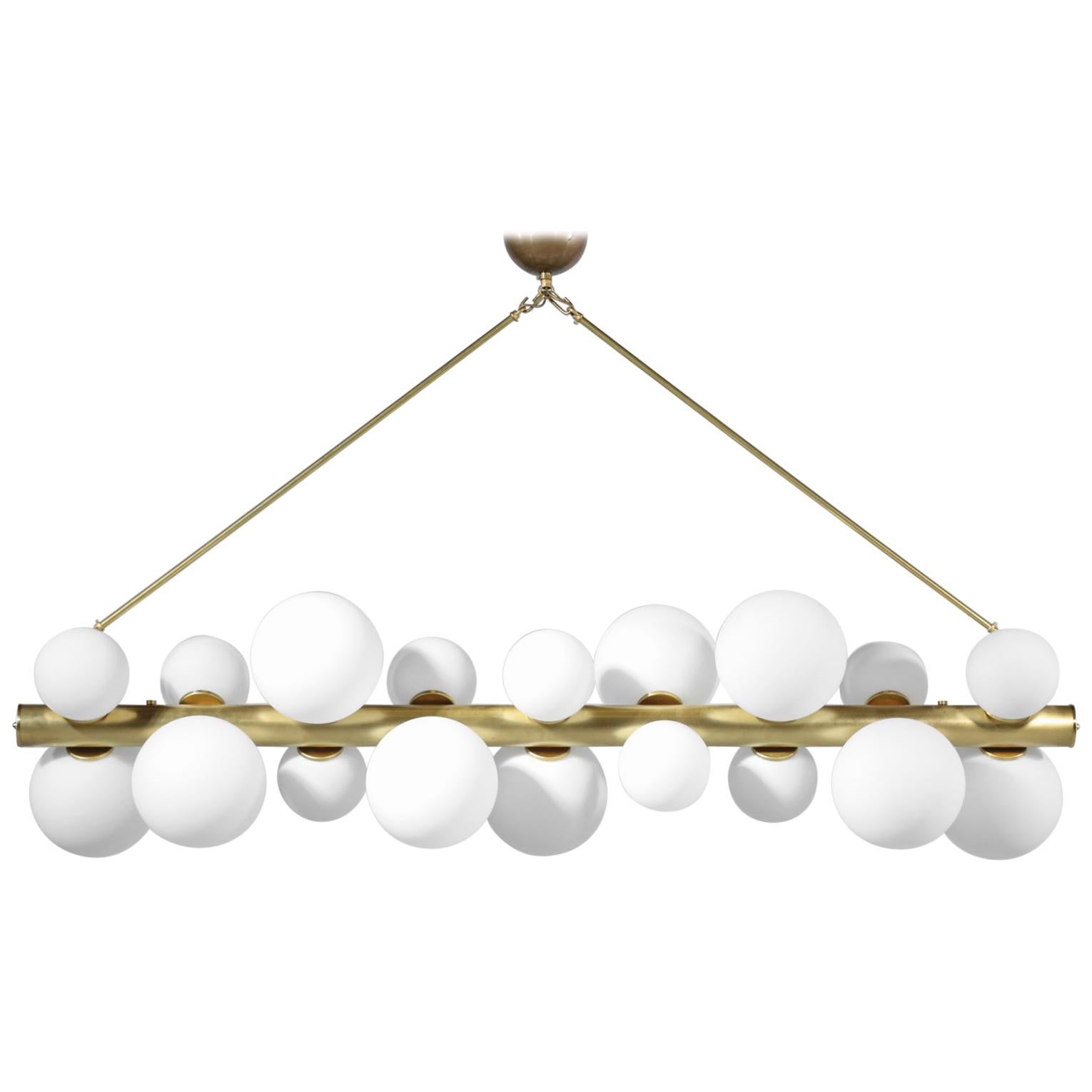 Beautiful modern chandelier Stilnovo style, structure in brass and alu with opaline light. Composed of 18 globes.
Artisanal work.
Bulb E14.
Great quality work

Custom on request.