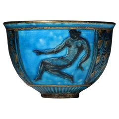 Small blue ceramic bowl by Jean Mayodon featuring a female figure – K102
