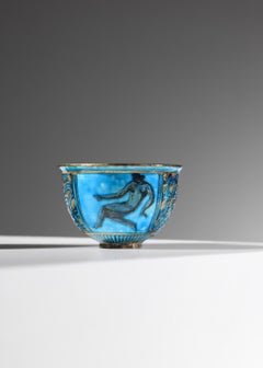 Small blue ceramic bowl by Jean Mayodon featuring a female figure – K102
