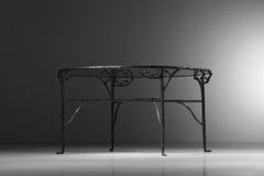 Bronze dining table with foliage decoration and glass top, 1980s, K172