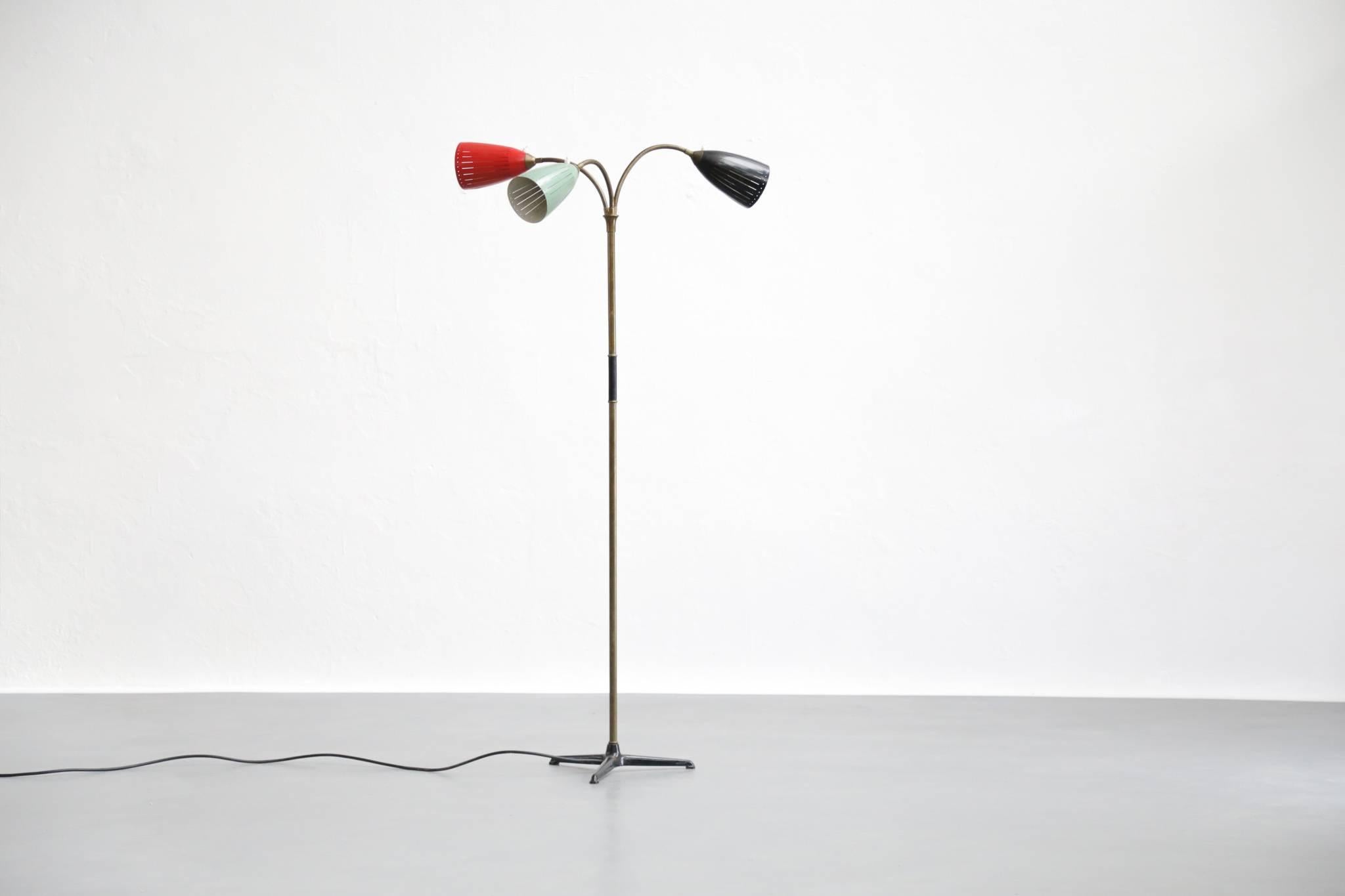 Three lights floor lamp with flexible arms.
 