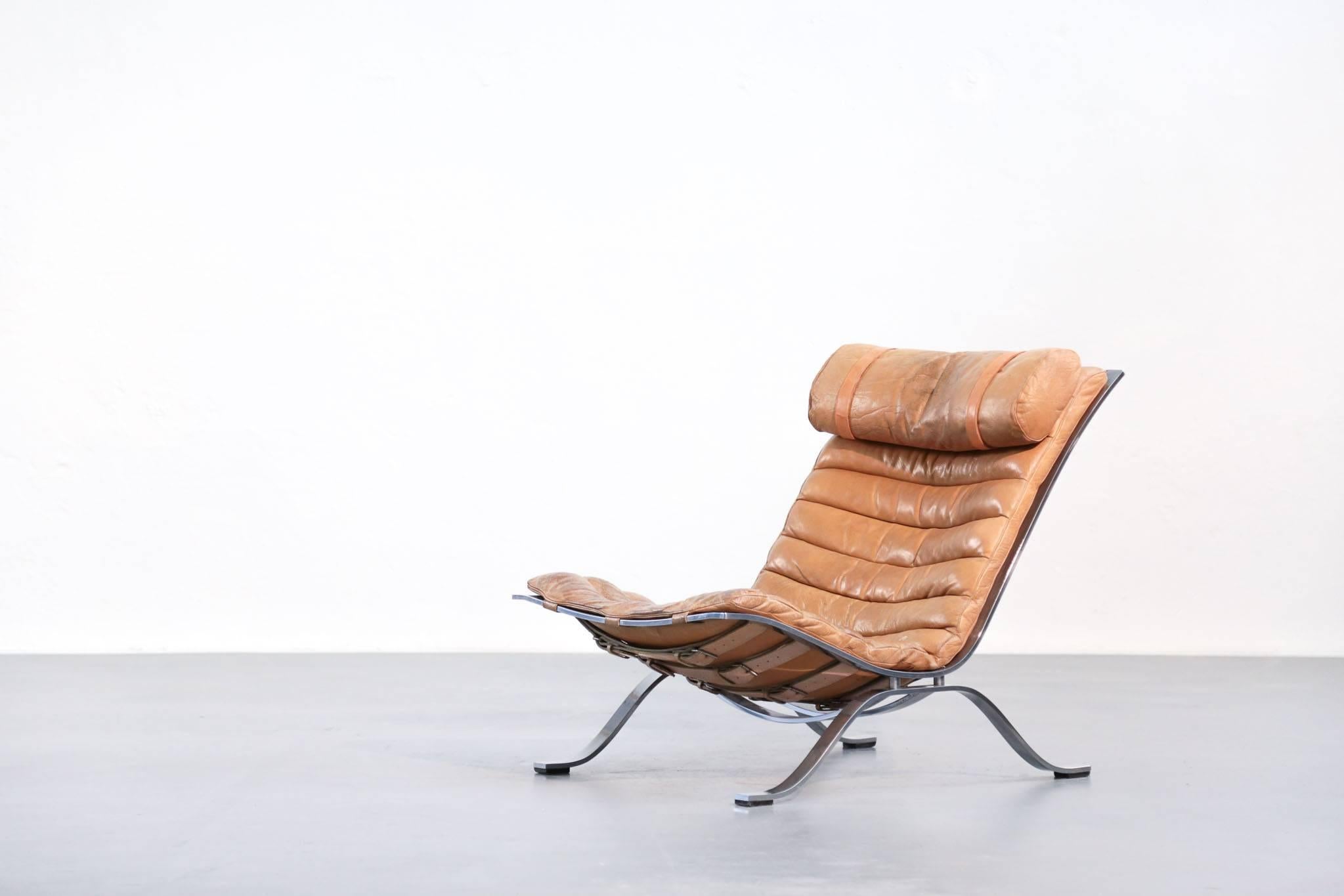 Ari lounge chair designed by Arne Norell, Swedish designer for AB Norell.
Amazing patina.