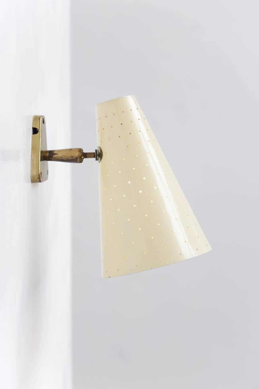 Italian design wall light sconce made of brass, shade in perforated metal.
 