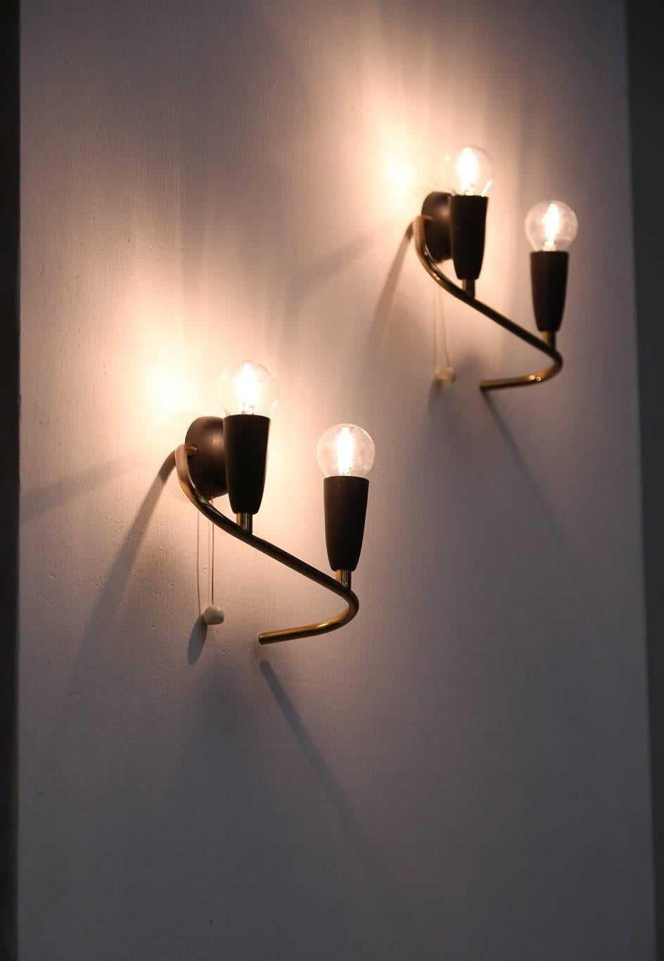 Pair of wall sconces made of brass and metal.
Italian design, 1950s.