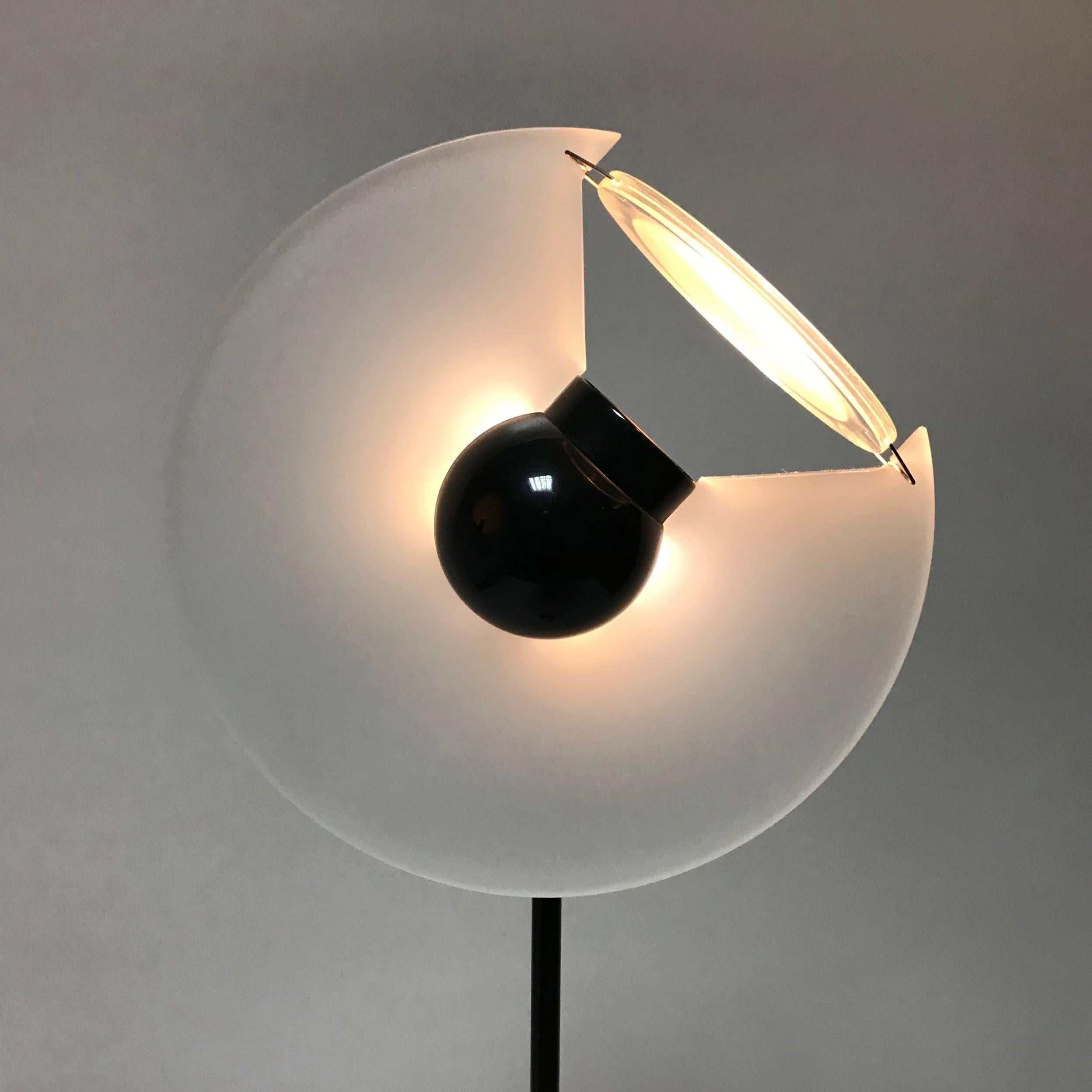 This 'Club' floor lamp was designed by Pier Giuseppe Ramella for Arteluce and was produced in Italy in 1983. This floor lamp of metal a white lacquered circular conical base and a black metal in height adjustable column on which is set an adjustable