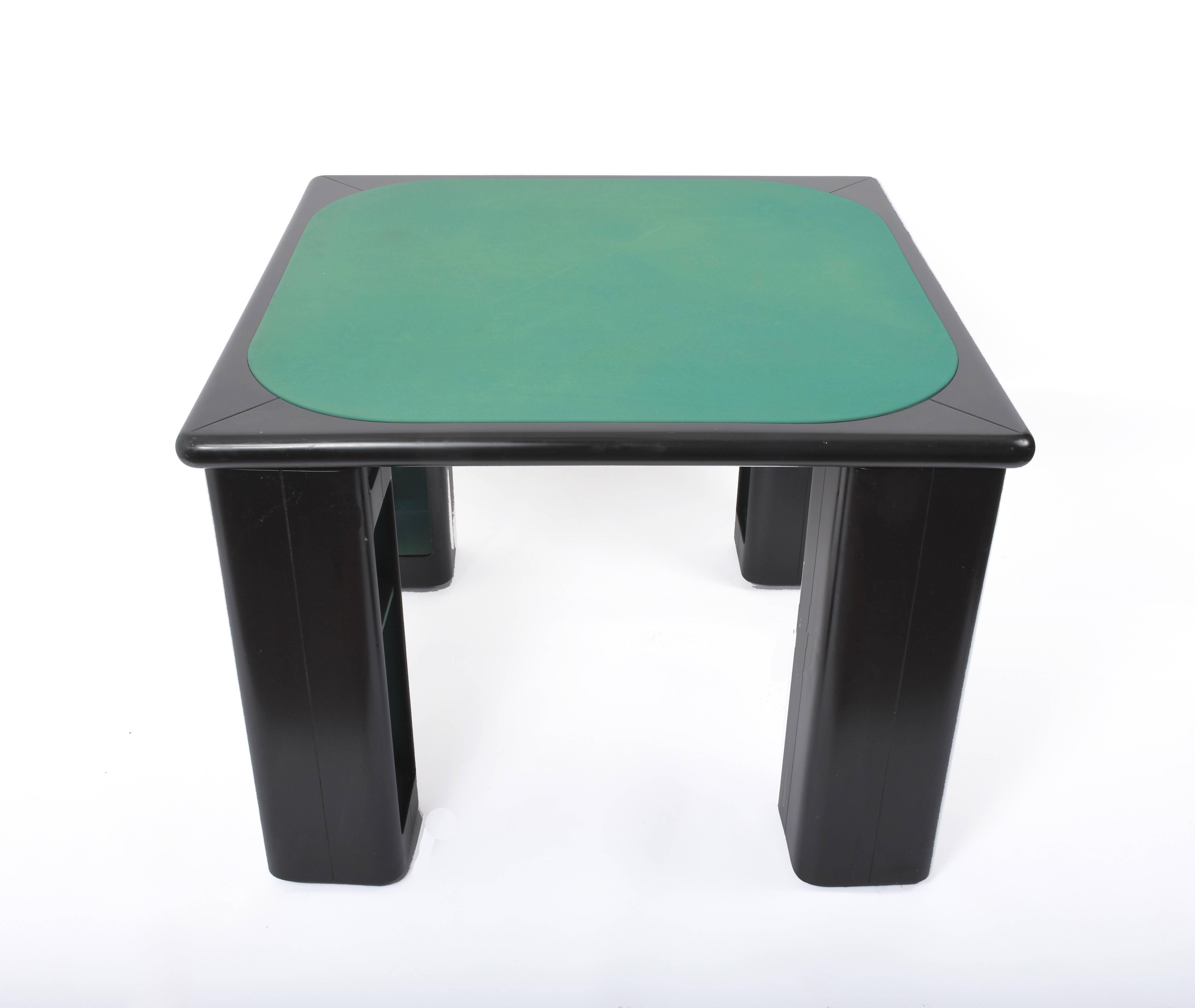 Card game or poker table by Pierluigi Molinari for Pozzi Milano signed - Structure in black lacquered glossy wood
All four legs can rotate around a chrome tube to reveal a deposit for cards / games or glasses
The laminated top shelf can be used to