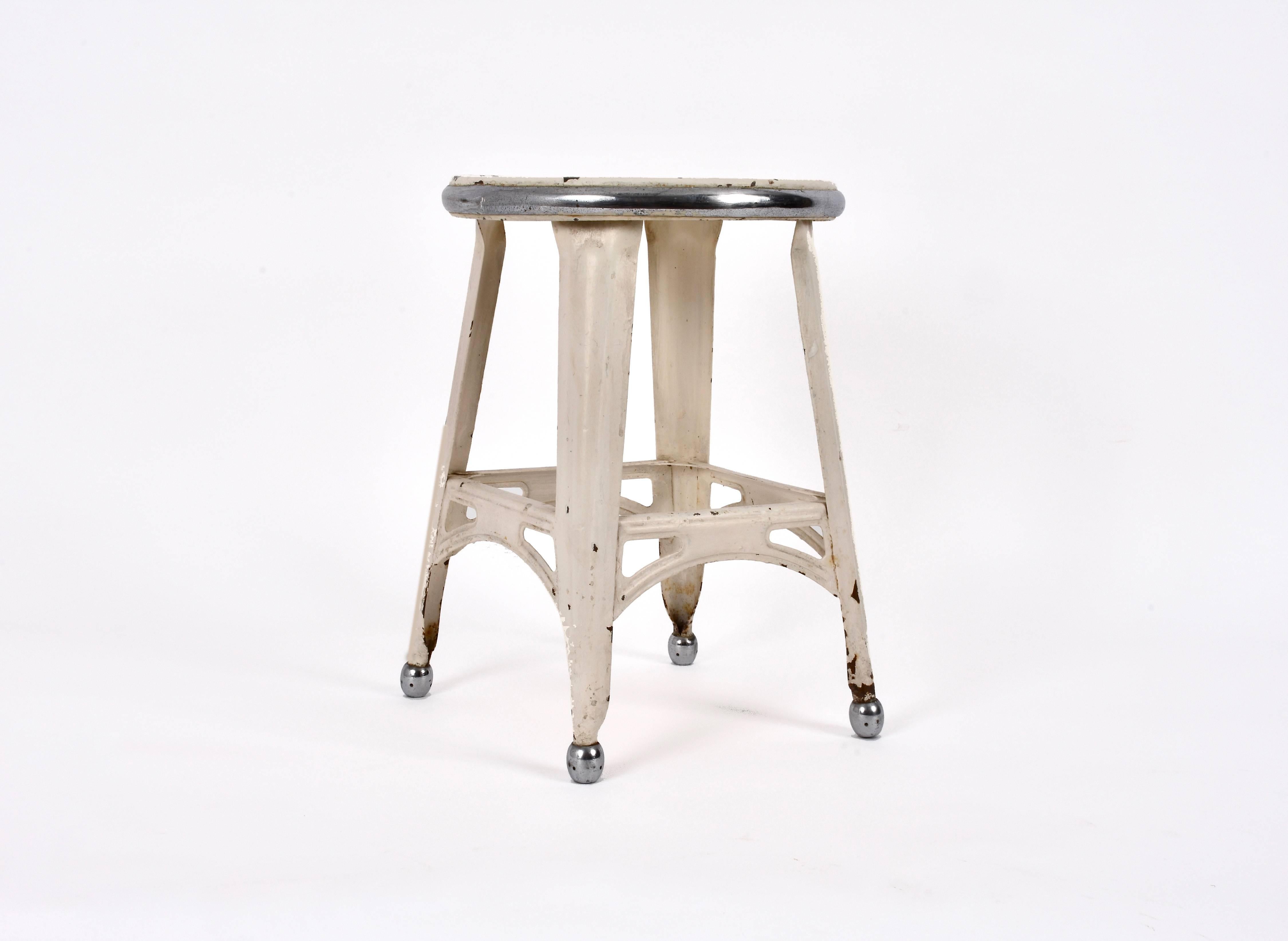 Industrial style French stool, in painted iron and chromed steel.