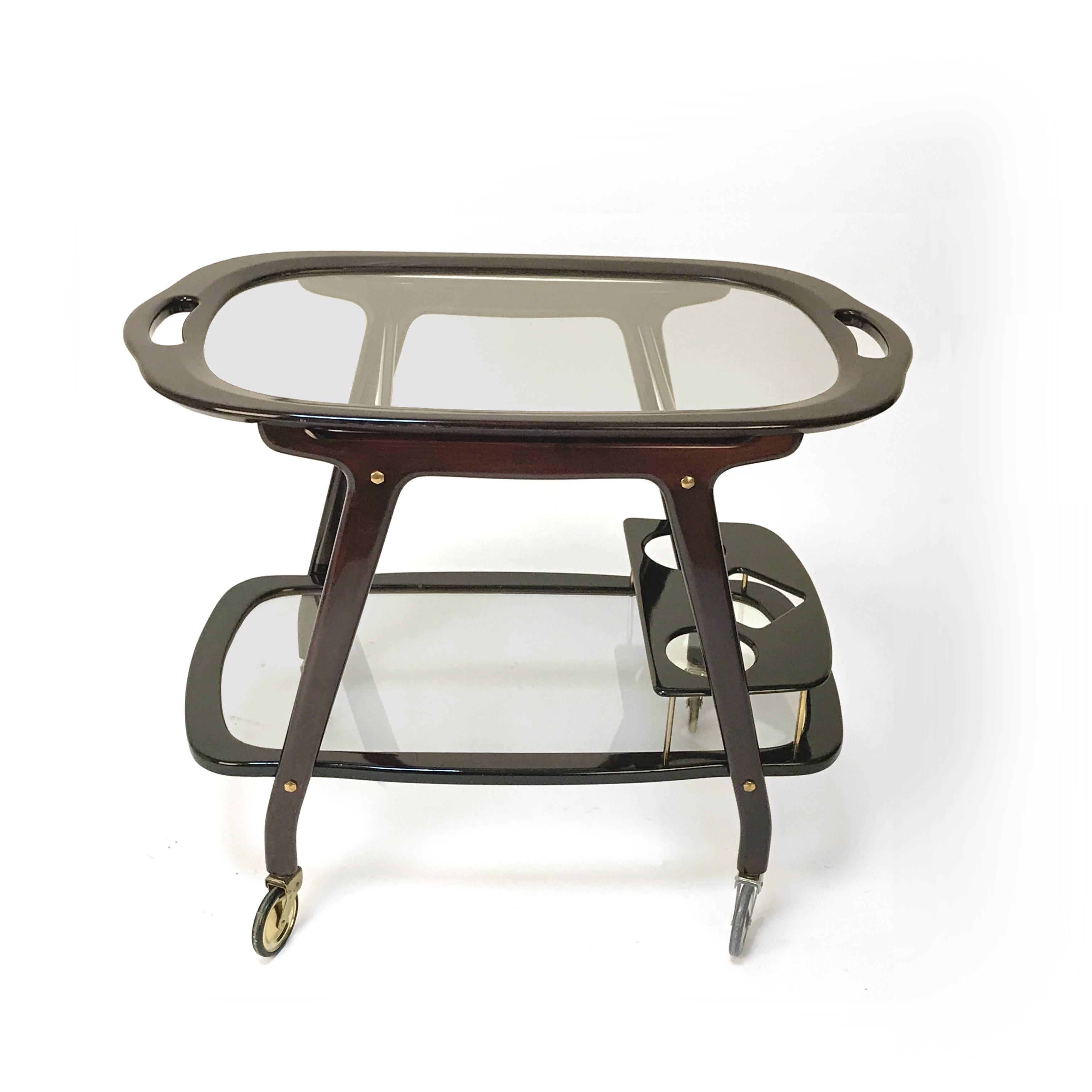Italian trolley designed by Cesare Lacca in the 1950s
in mahogany.
The lower shelf is equipped with a bottle holder, the upper shelf can be removed as a tray. Professionally restored.
