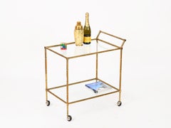 Carrello da bar Maison Jansen in ottone e cristallo con finitura finto bambù, anni '70