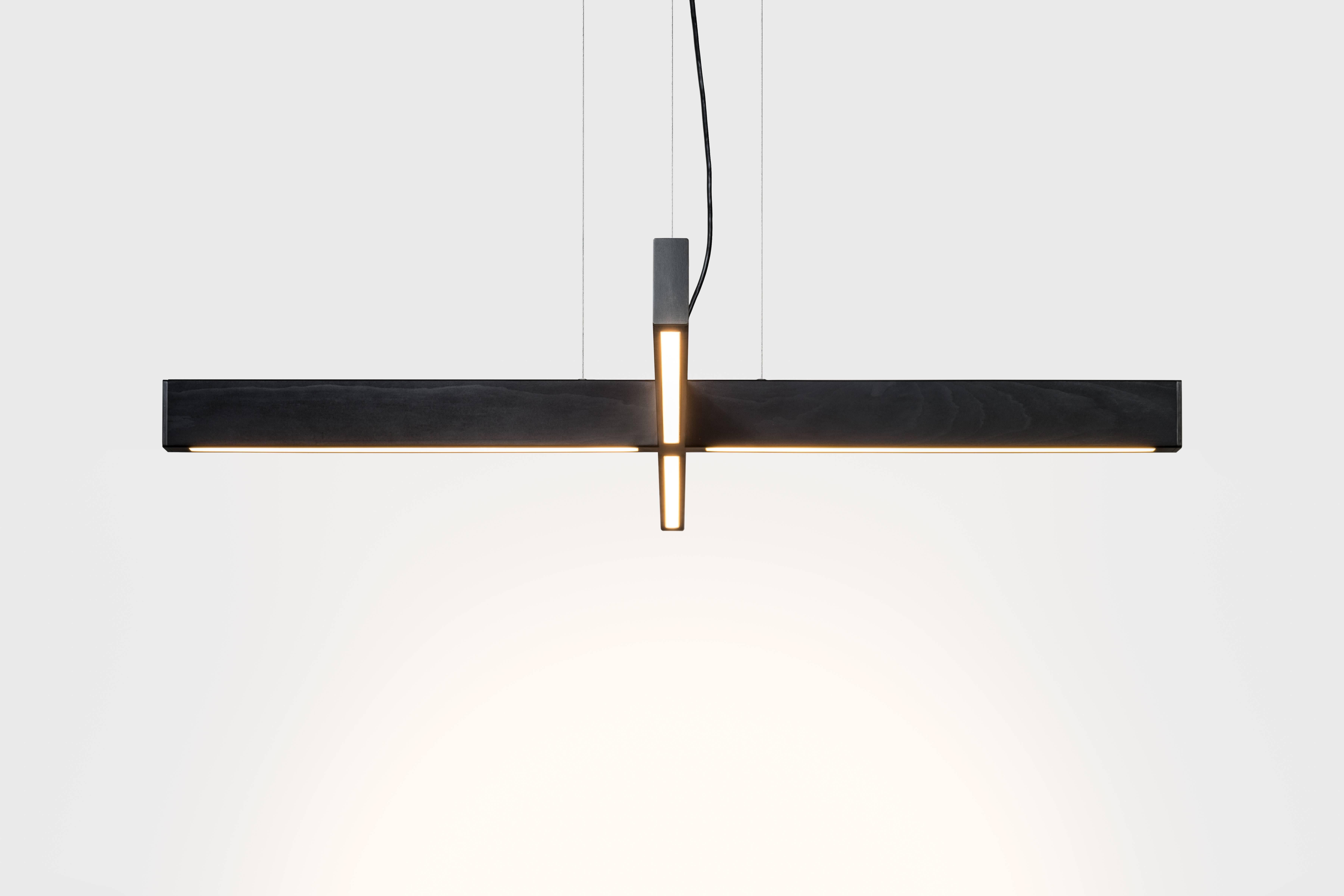 The 2x4 Plus Pendant expands on our classic 2x4 pendant, exploring new relationships through the intersection of the wood bodies. Minimal in form, the Plus Pendant is still large in its presence.

Custom finishes and sizes available upon request.