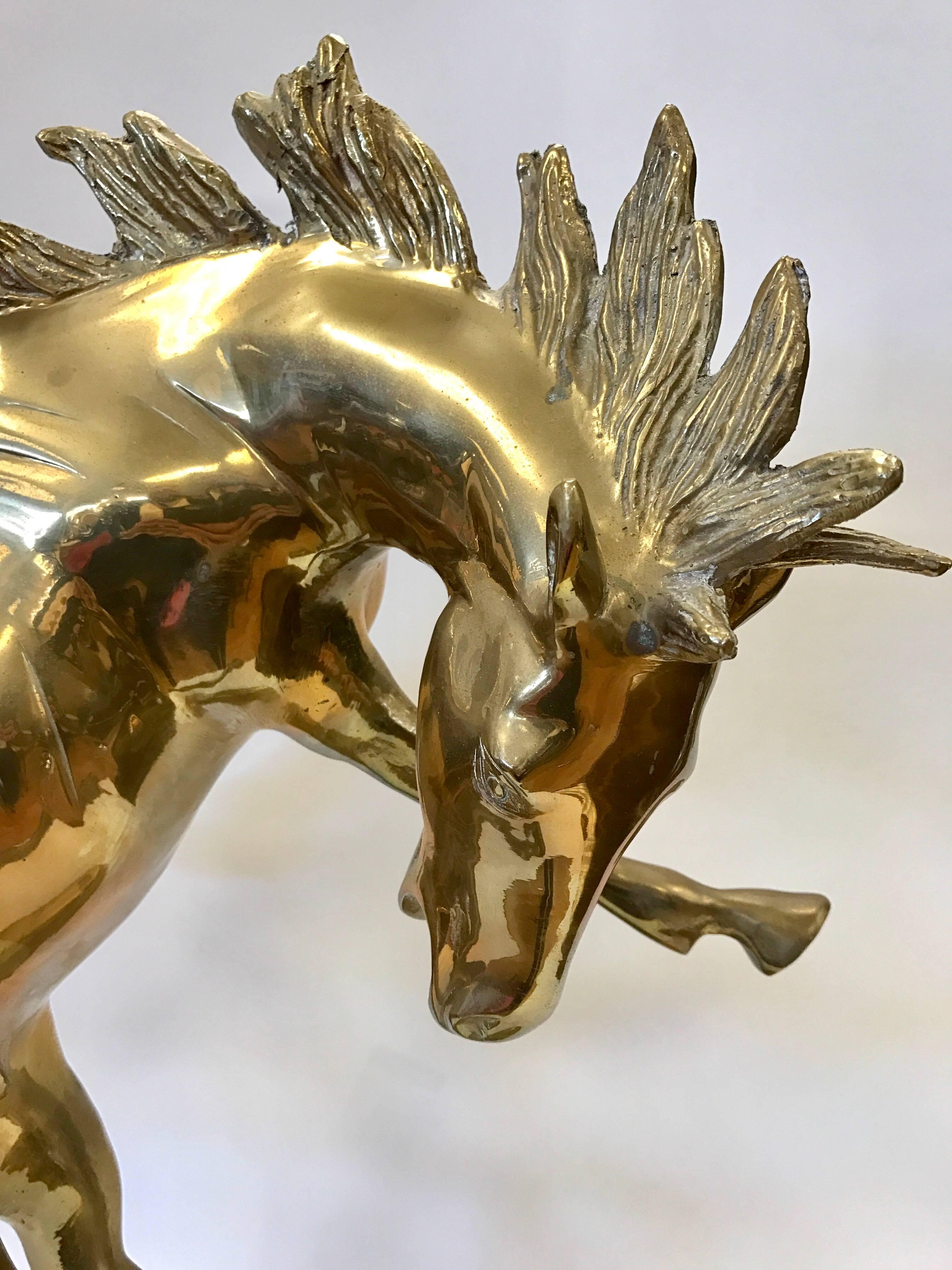 Large midcentury brass bucking horse sculpture.