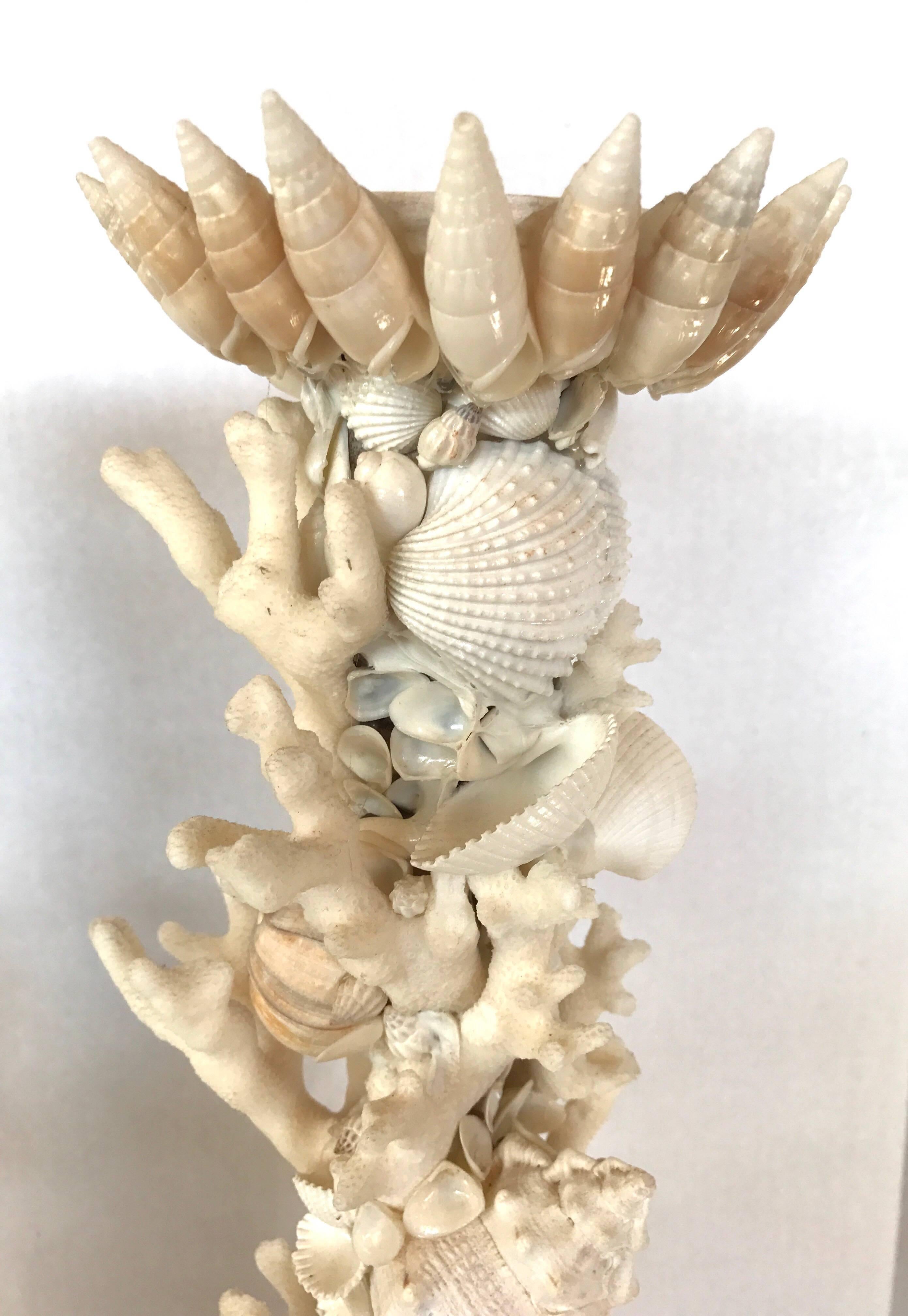 Rare pair of handmade, tall seashell encrusted candlesticks. Guaranteed to make a statement at your beach house. Think Tony Duquette in style and scale.