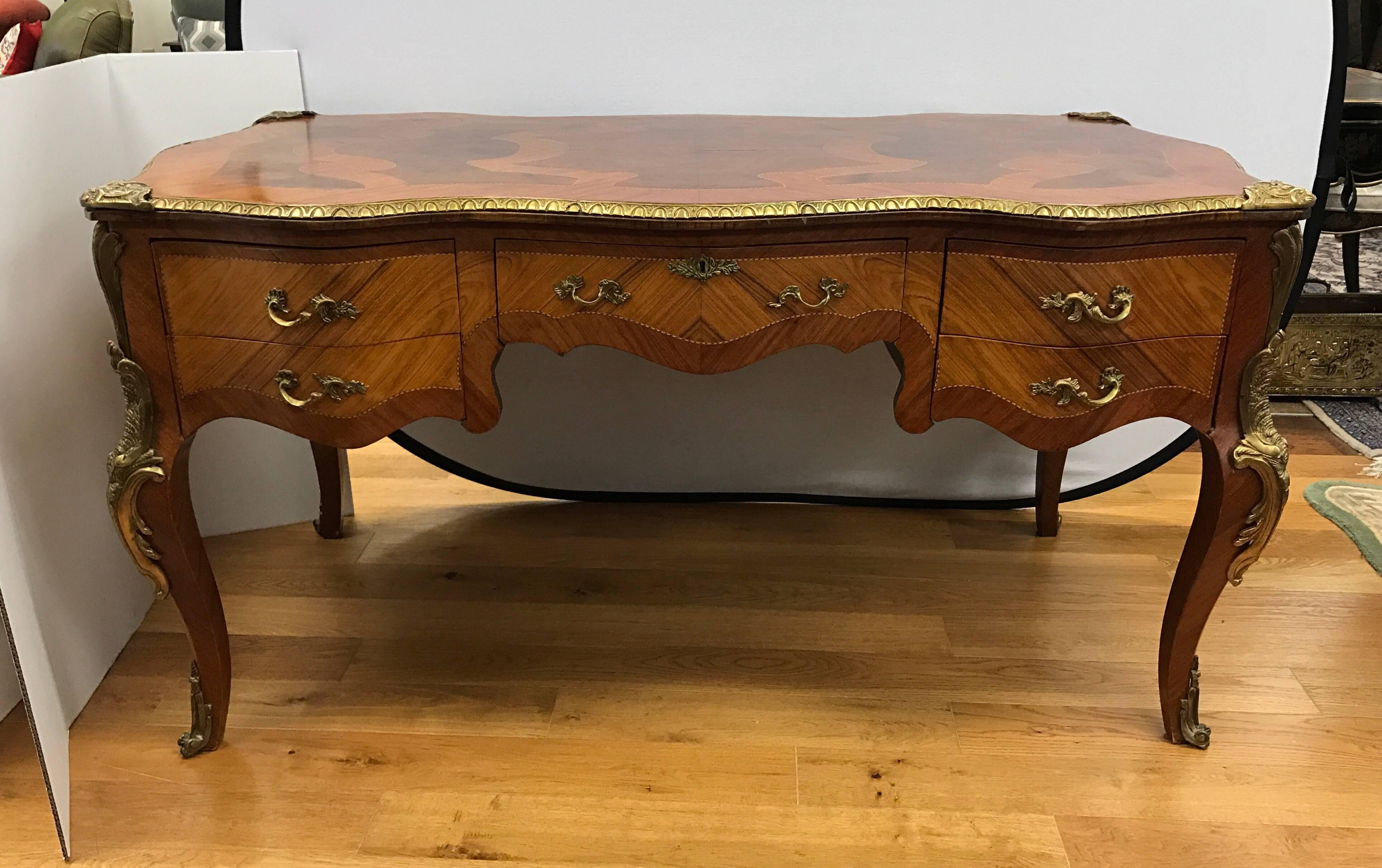 19th century French Louis XV writing desk or bureau plat with ormolu mounts and kingwood parquetry. Features a gorgeous parquetry design on desk top.