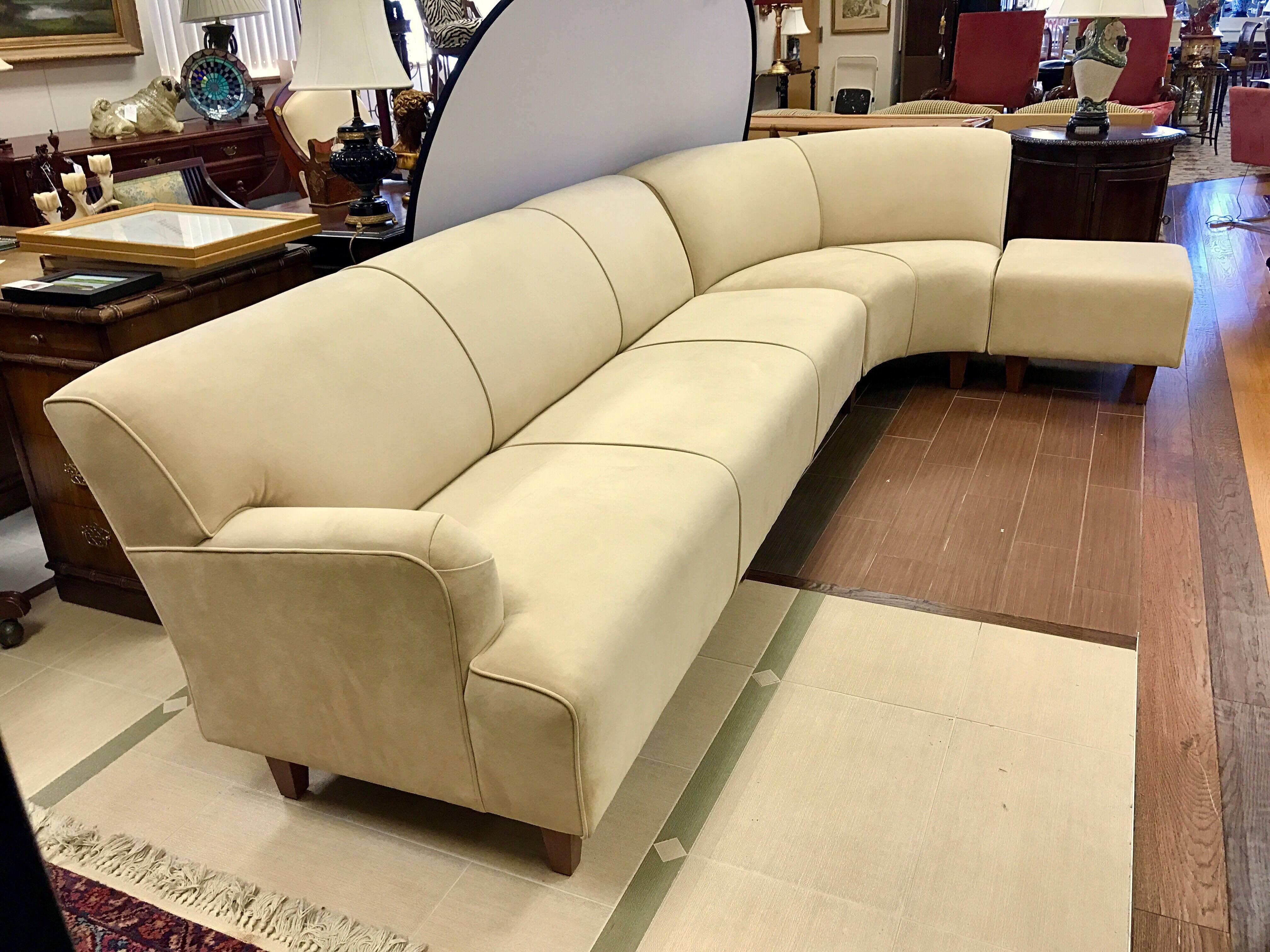 Newly upholstered in beige suede leather, this three-piece curved sectional sofa, in the style of Vladimir Kagan, is a must have. Total dimensions are below. The individual dimensions are as follows:
1. Long left facing piece - 82 inches wide x 31