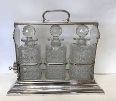 Sheffield Silver and Crystal Three Bottle Tantalus Set