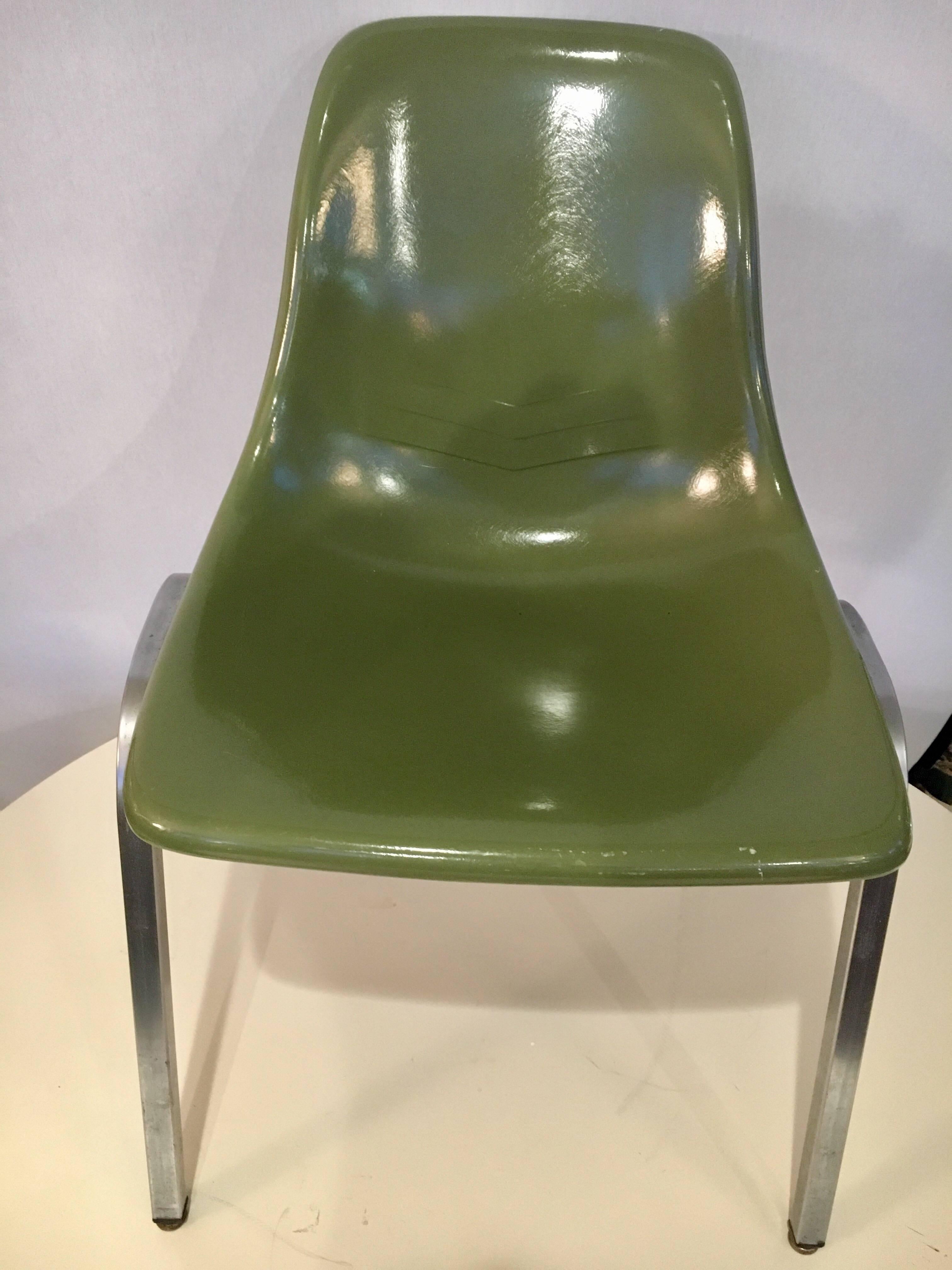 Rare olive green color scheme set of five matching Howell fiberglass chairs. Manufacturer hallmarks on base of chairs.