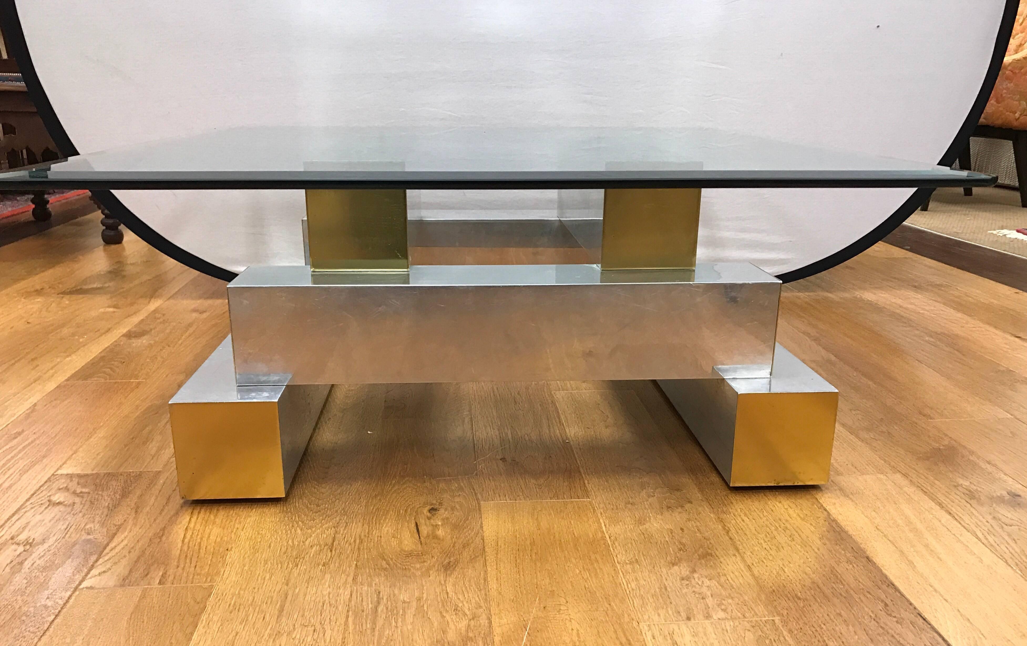 Mid-Century Modern cityscape coffee table by Paul Evans has a square glass top with chrome and brass base.
Measurement of glass on is 36 inches by 36 inches
Measurement of base is 29 inches by 29 inches by 14 inches tall.