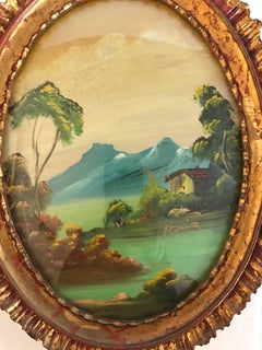 Paire de peintures à l'huile ovales italiennes signées dans des cadres en bois doré