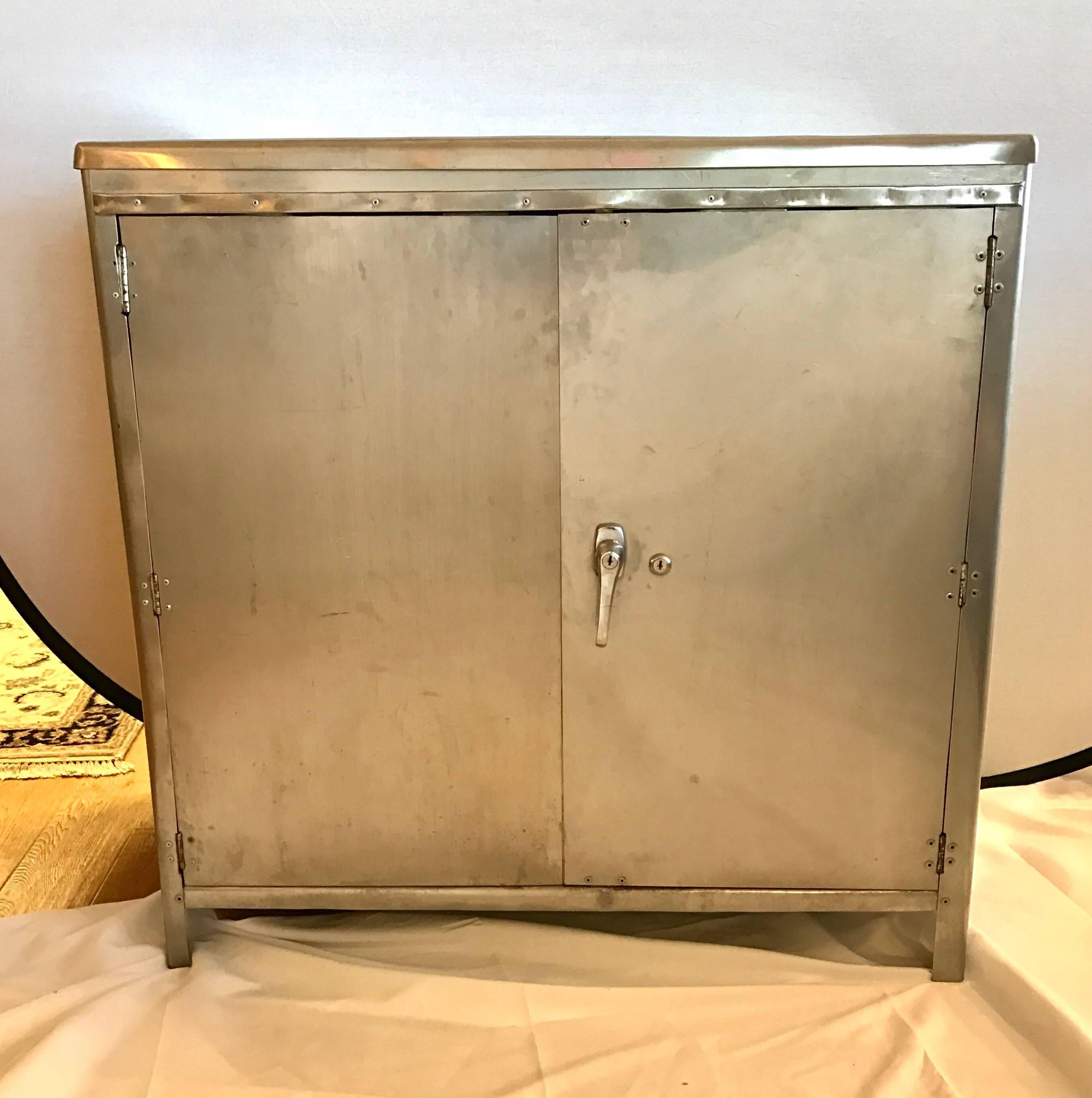 Multi purpose Industrial metal/steel bar cabinet or credenza with a polished finish. Has one shelf. Just the right size for your apartment or large home.