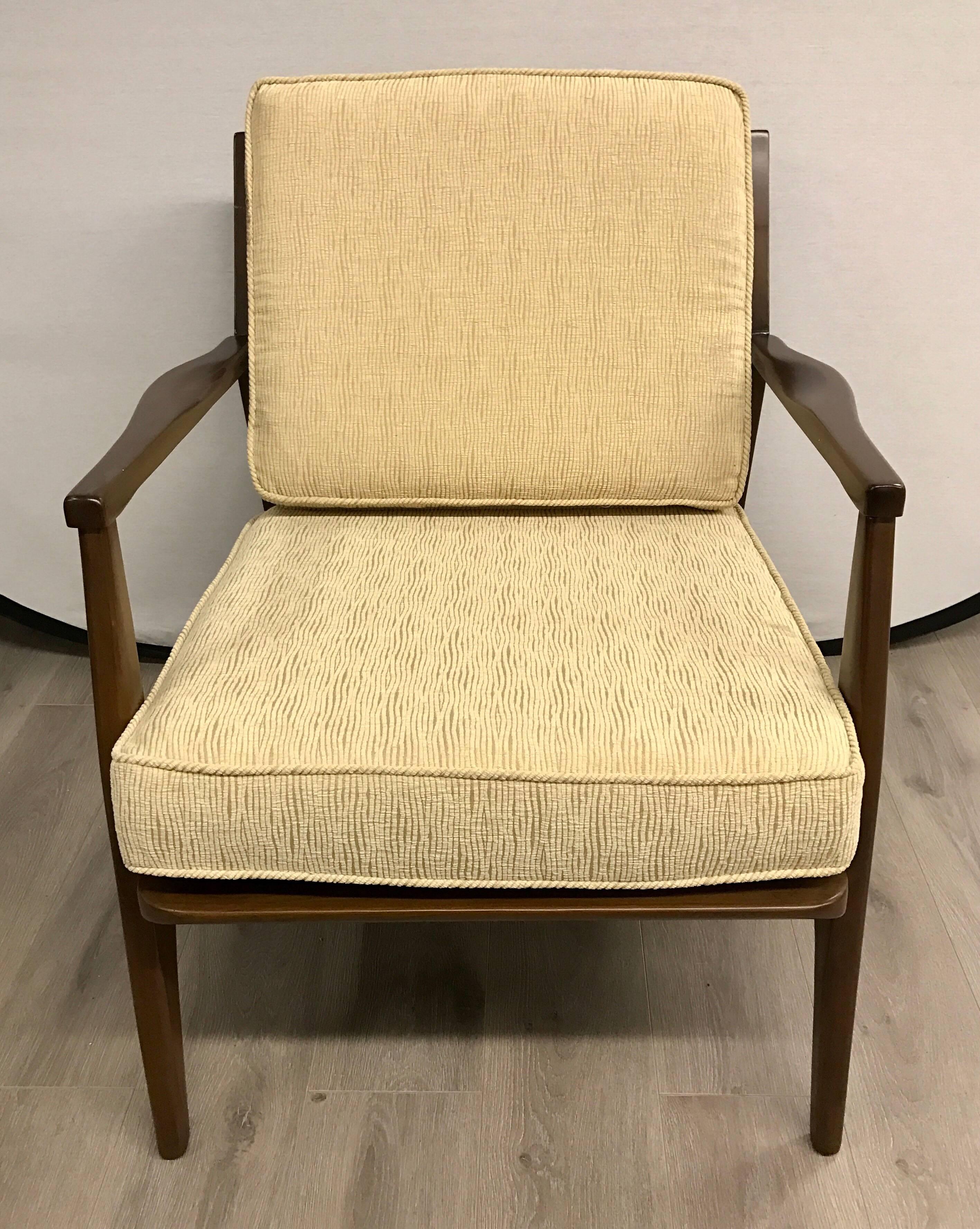 Elegant, newly reupholstered, pair of 1960s Danish dark teak arm chairs. Fabric is a luxurious woven textured cotton and is the color of straw, see pics.