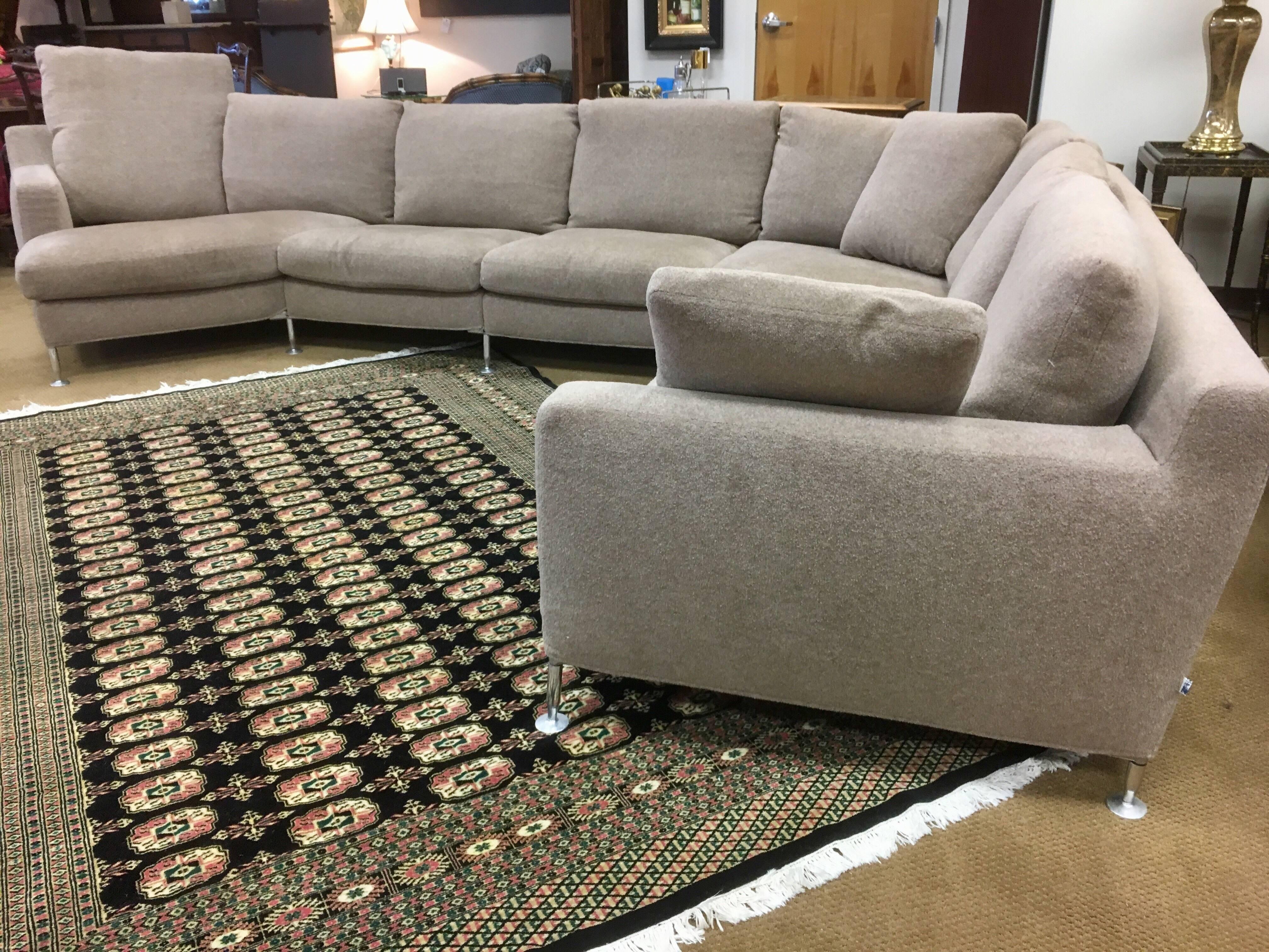 A signed B&B Italia Harry sectional sofa designed by Antonio Citterio. The Harry sectional is Citterio's masterwork at B&B Italia given its one of a kind curved lines on the exterior and it popularity. This piece has a left hand corner