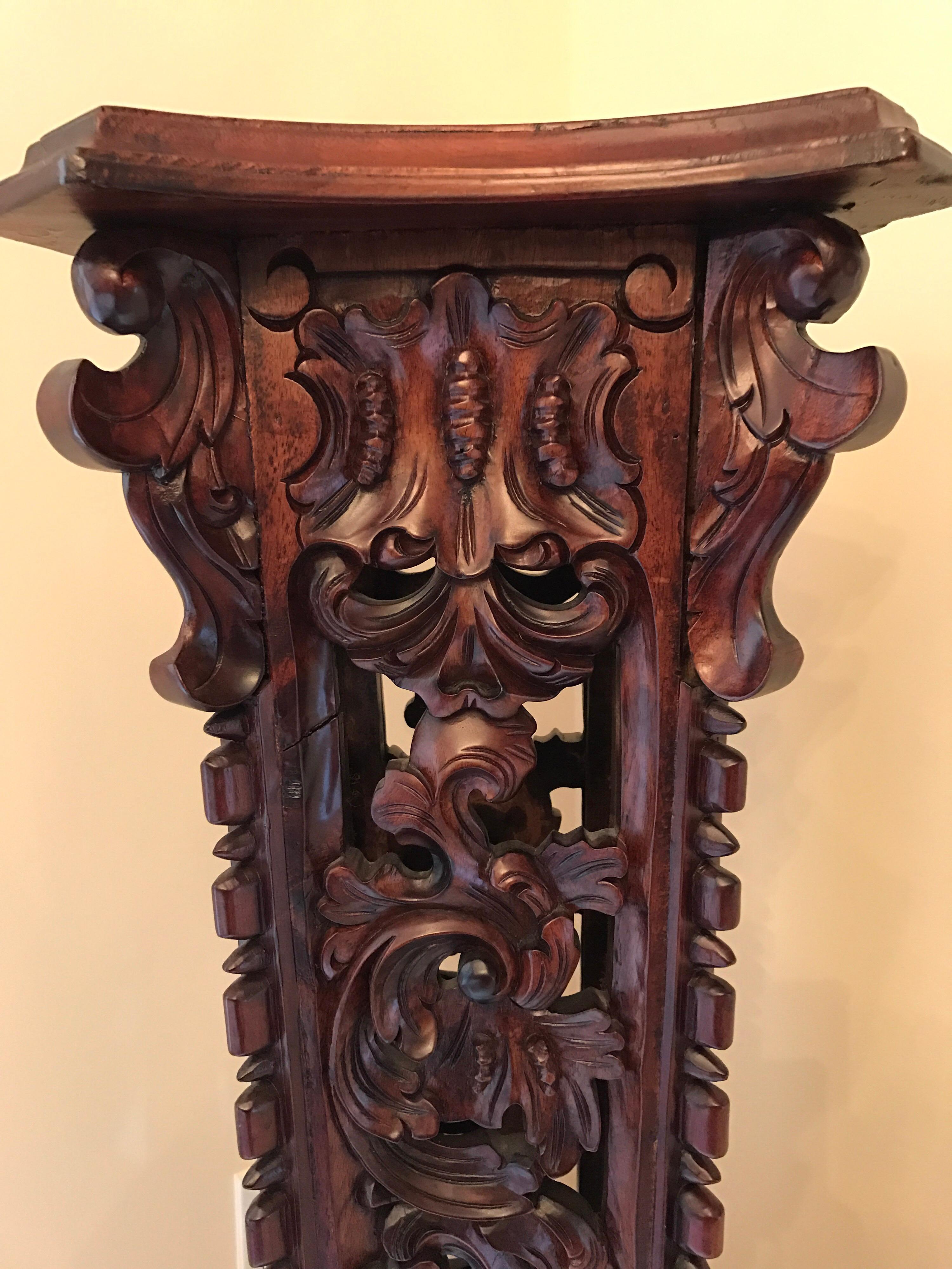 Elegant mahogany wood intricately hand carved pedestal. 