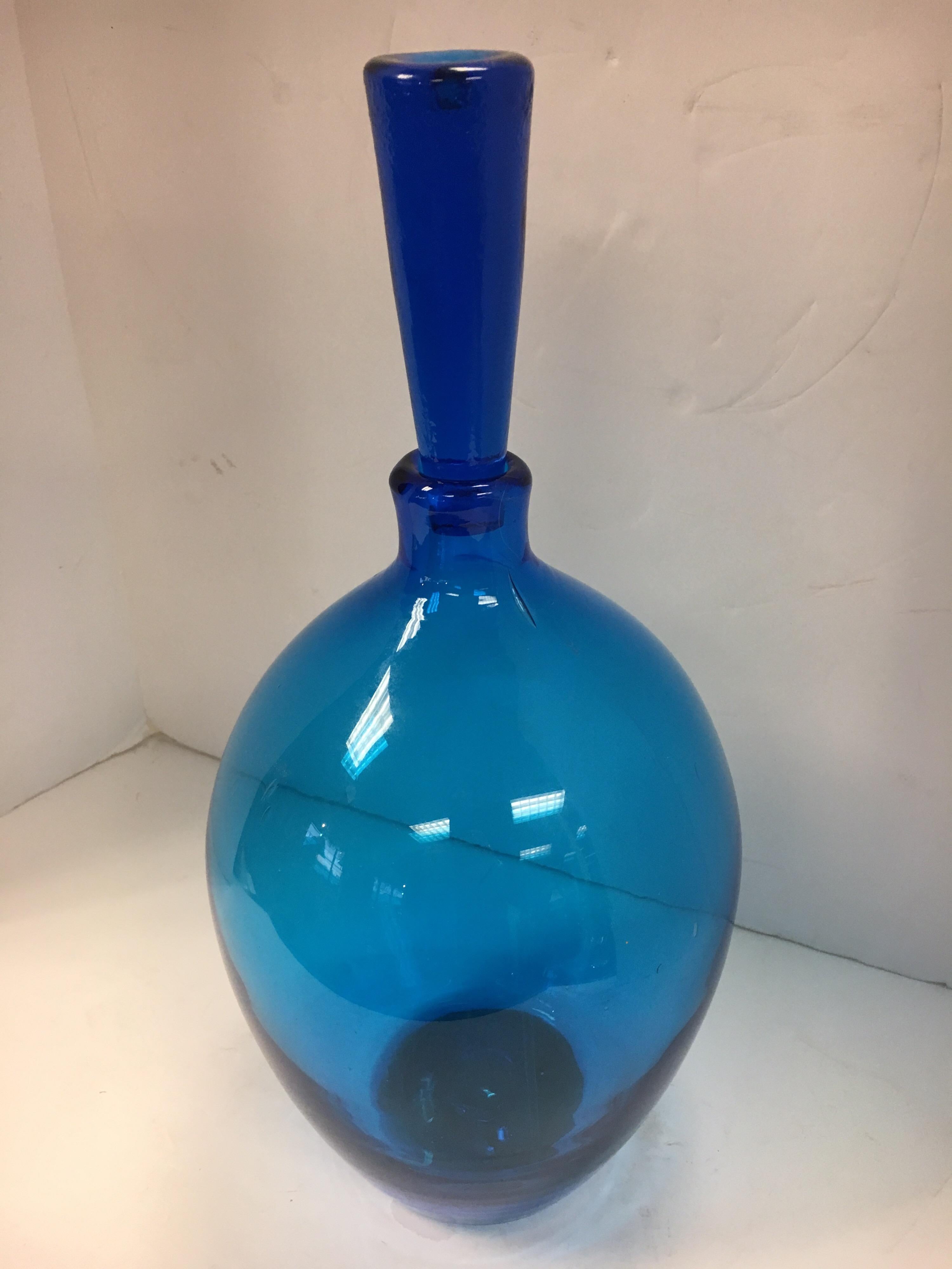 Made in Italy blue glass decanter with cap.