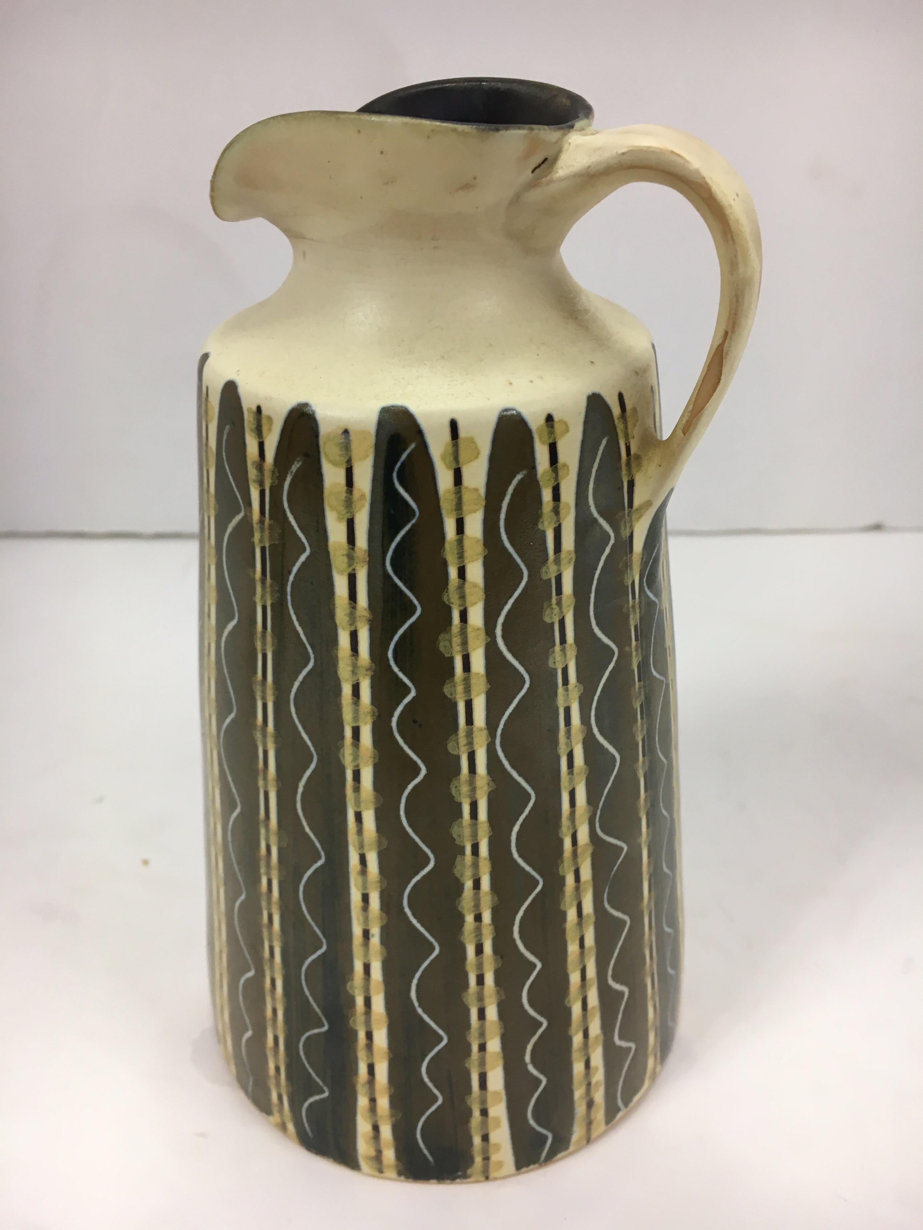 Small ceramic pottery water pitcher signed 