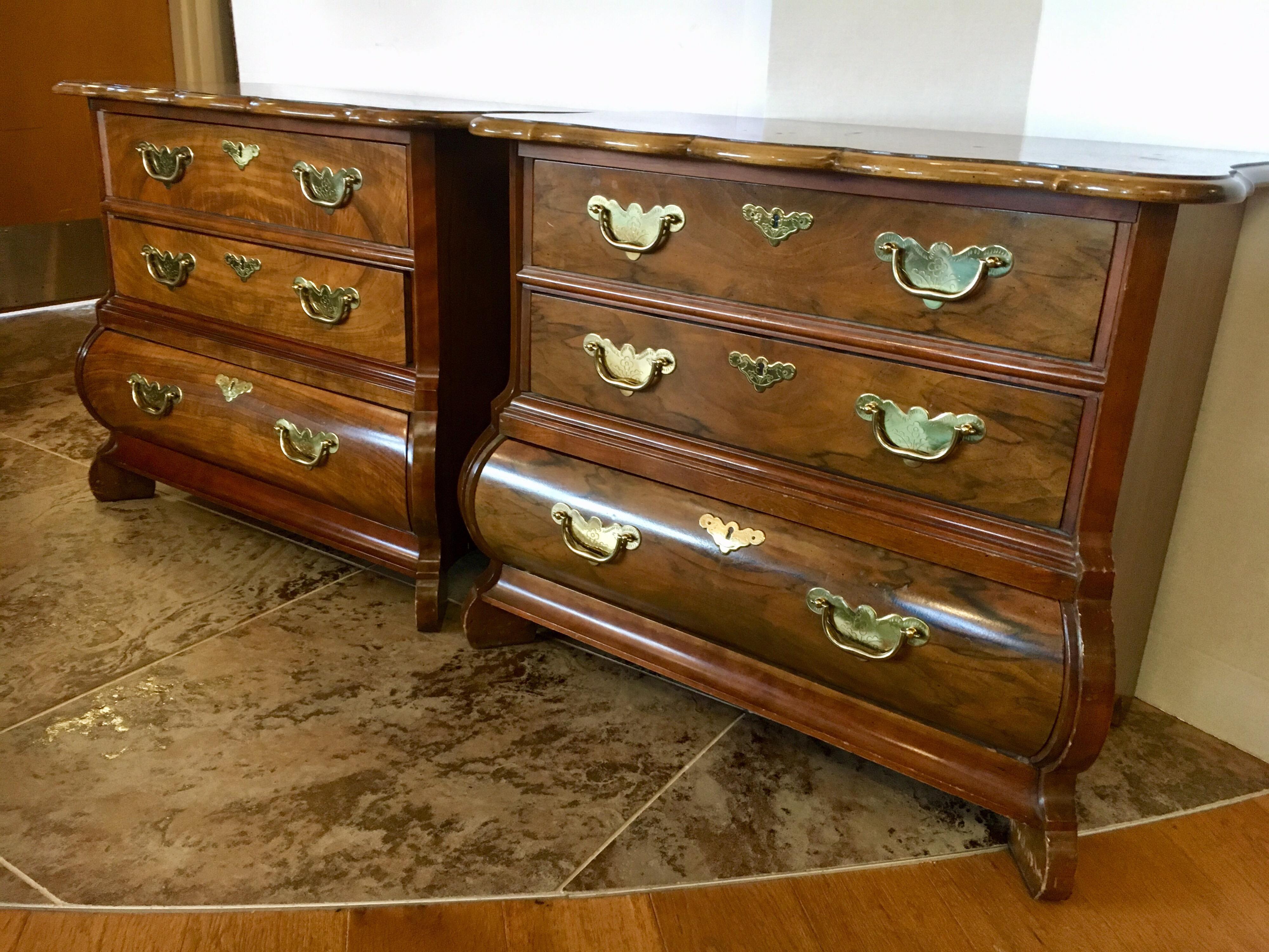 Gorgeous pair of Baker Furniture mahogany nightstands with three drawers and brass hardware.