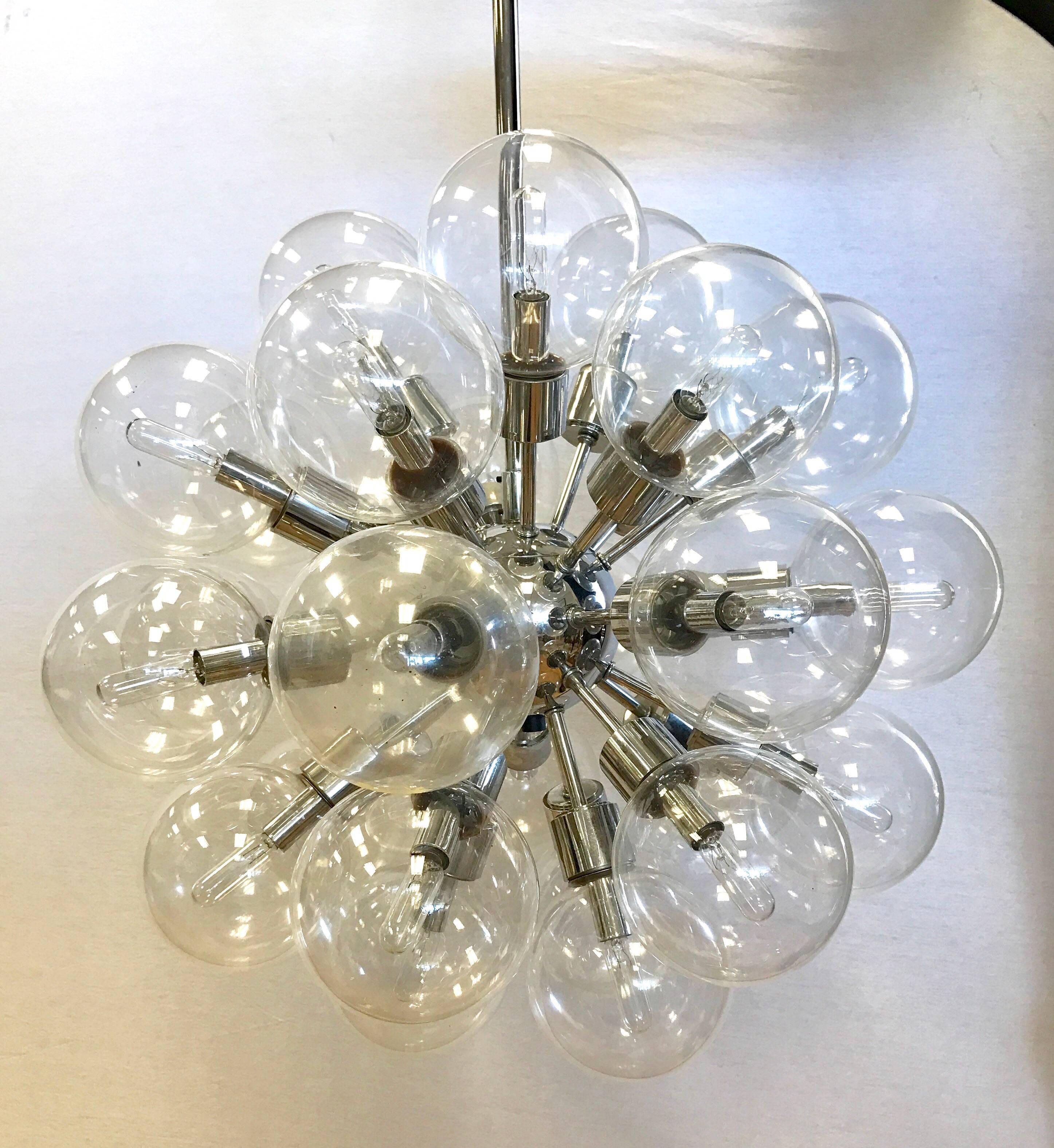 Rare set of four matching Mid-Century Modern Lightolier 30-light sputnik chandeliers, circa 1960s. Feature 30 original glass globes on polished chrome spokes radiating from a central chrome nucleus. They are made of polished chrome and has some