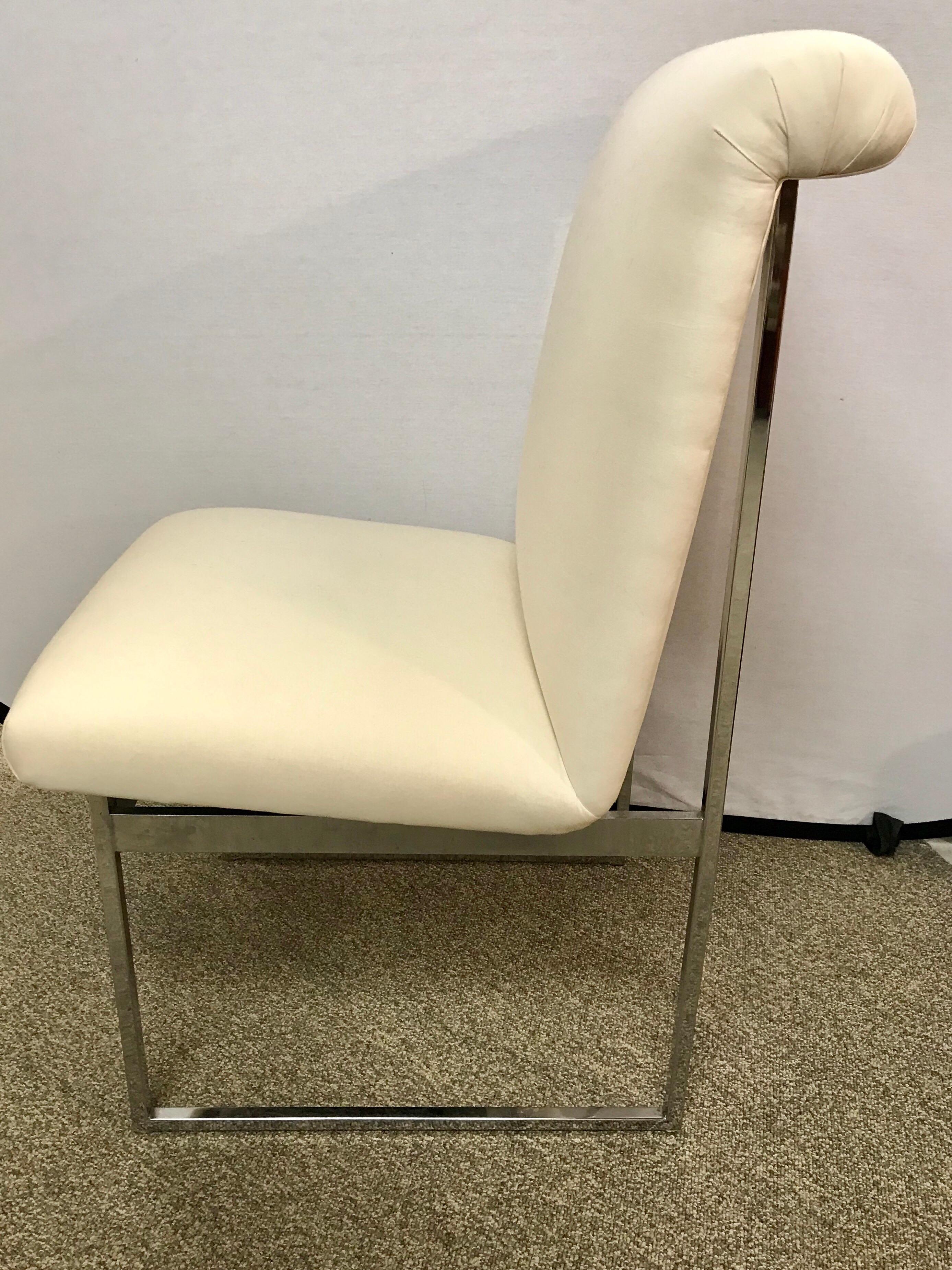 Elegant Milo Baughman style midcentury chair with polished steel and off white newer fabric.